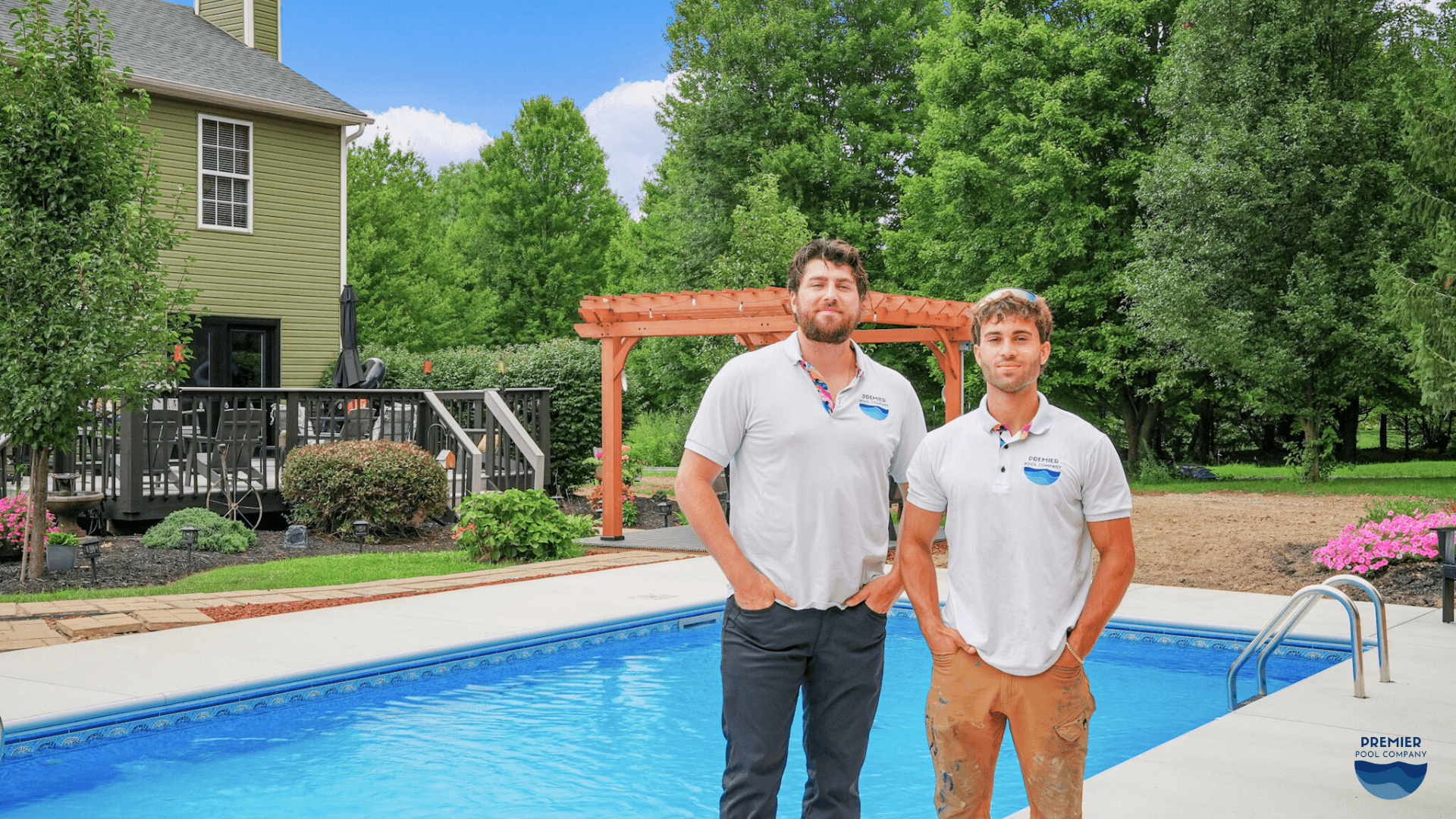 The Premier Pool Co. team standing beside a completed vinyl liner inground pool ready to help homeowners plan 2026 projects