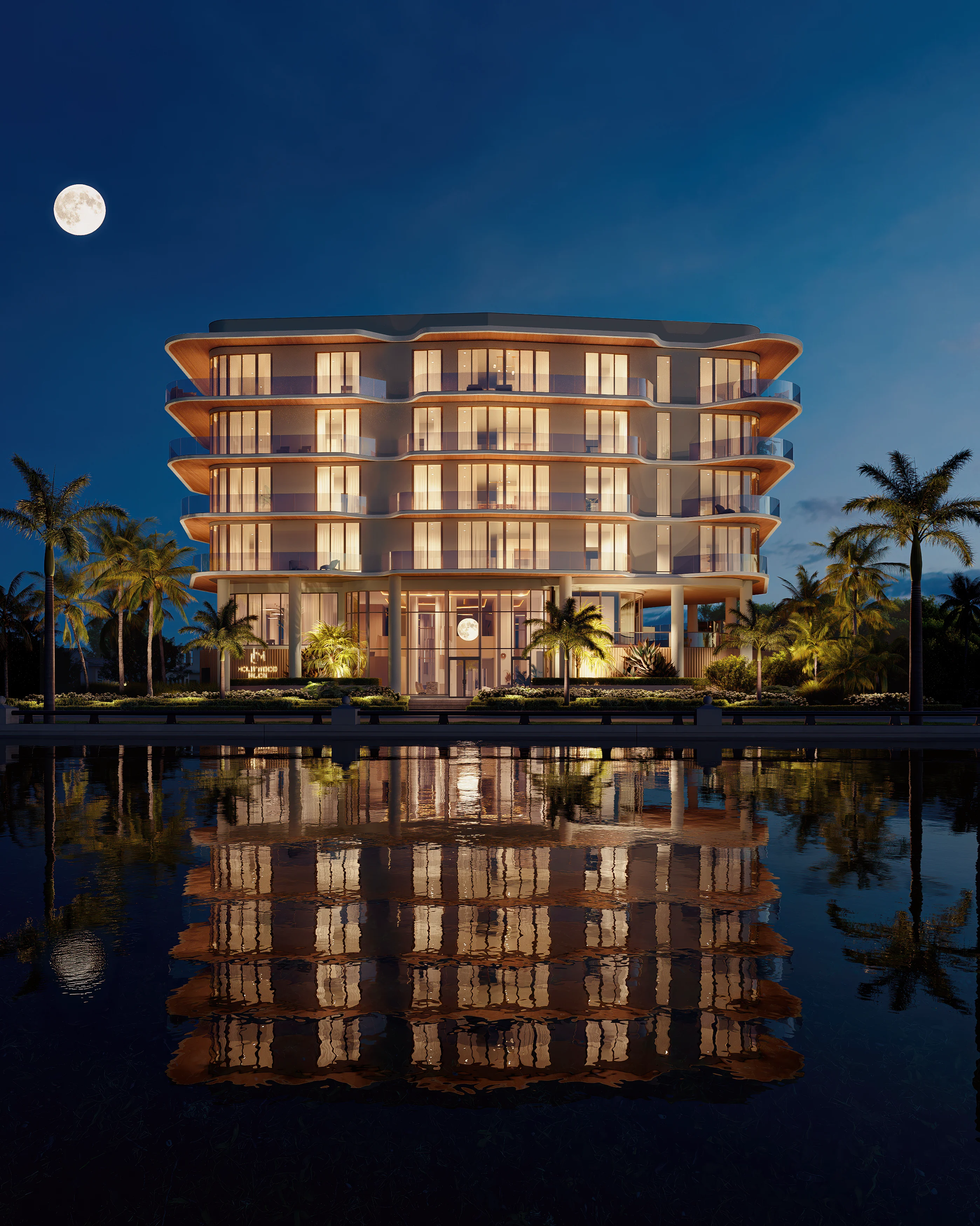 Night view of an oceanfront property, illuminated by soft lights, with waves gently lapping at the shore under a starry sky.