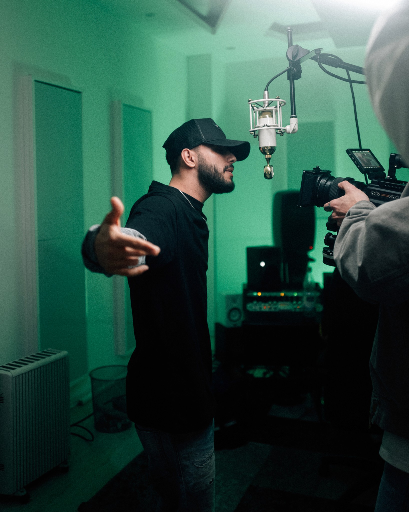 nash rapper in the studio recording a song, rapper recording a song