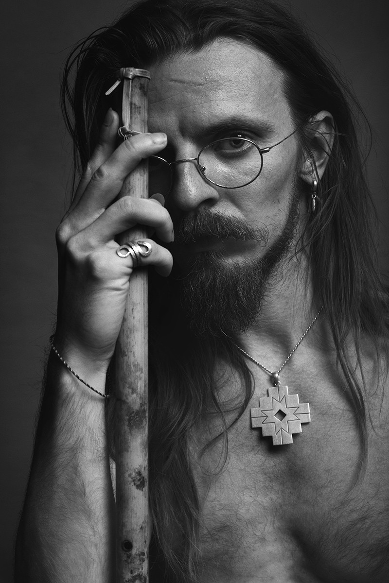 a blurry photo of a person standing in front of a wall