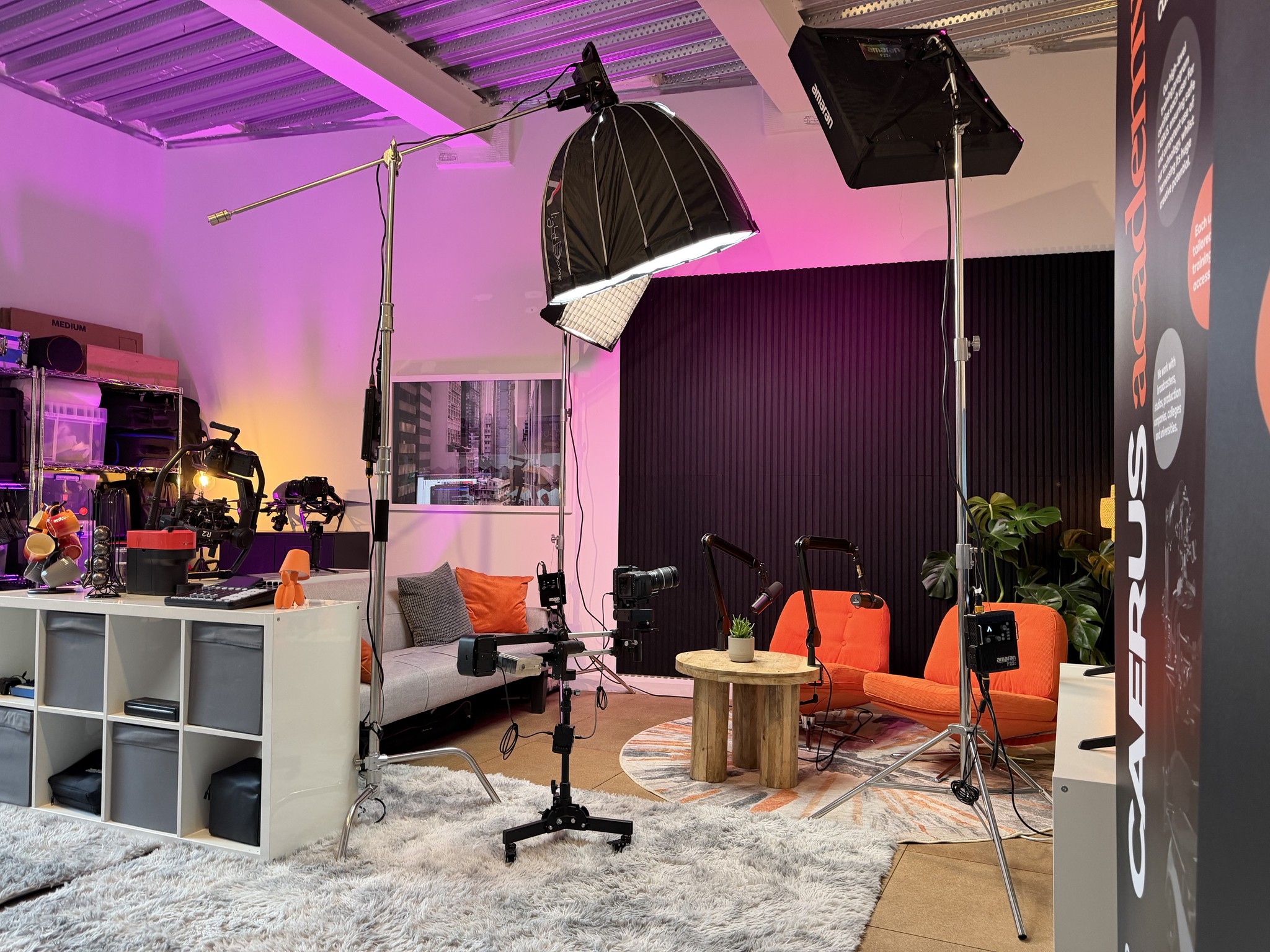 Letterbox image of part of the DMM studio, showing seating of the Podcast space