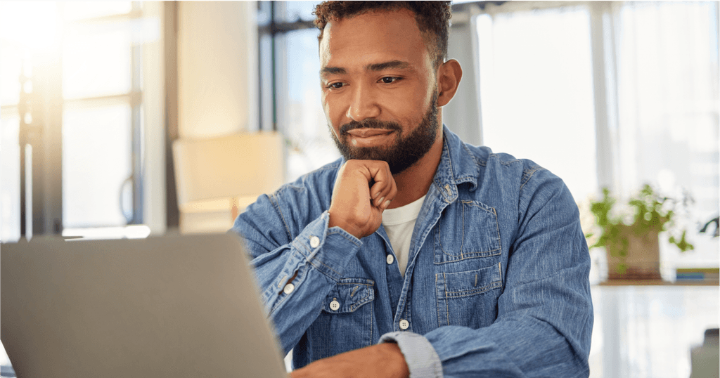 Person at dining table using laptop to find lawyer