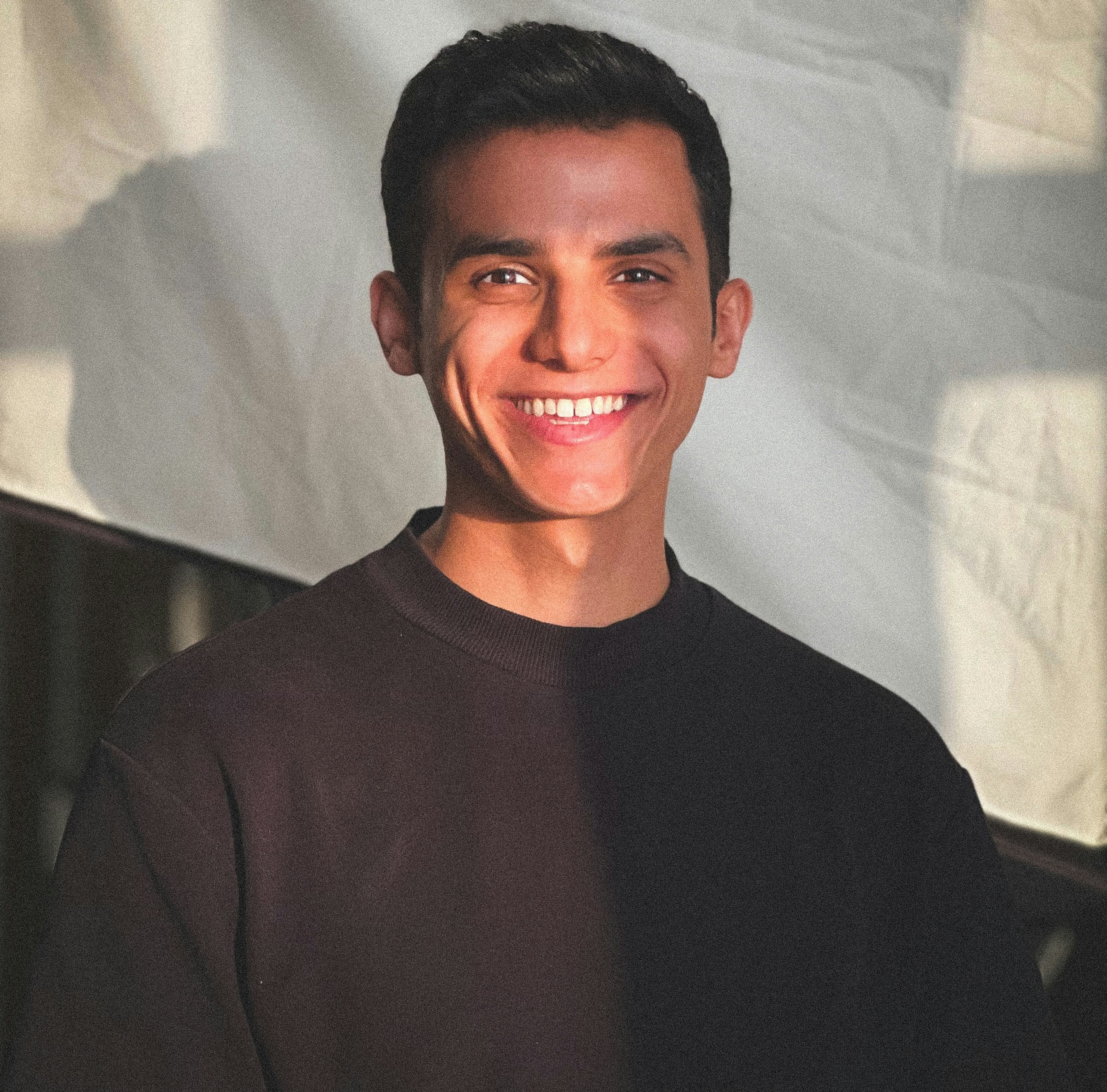 Picture of John Cook Wearing a black T-shirt
