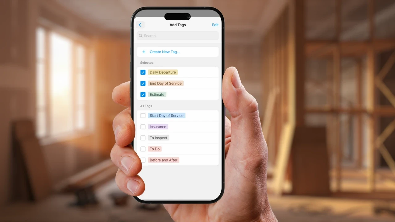 a hand holding a phone shopwing the photo tag feature of magicplan