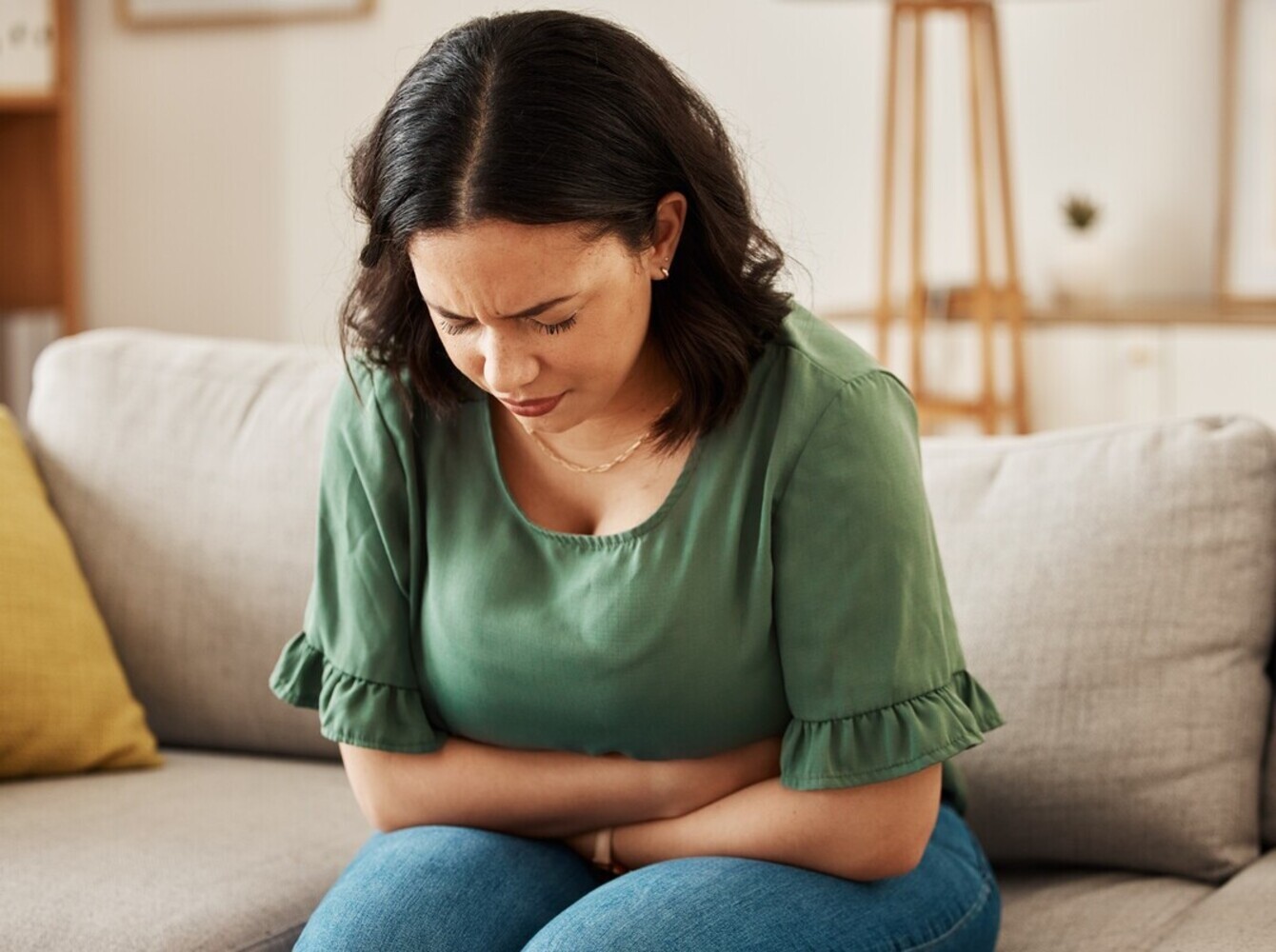 woman experiencing nausea from side effects of pills to help you lose weight