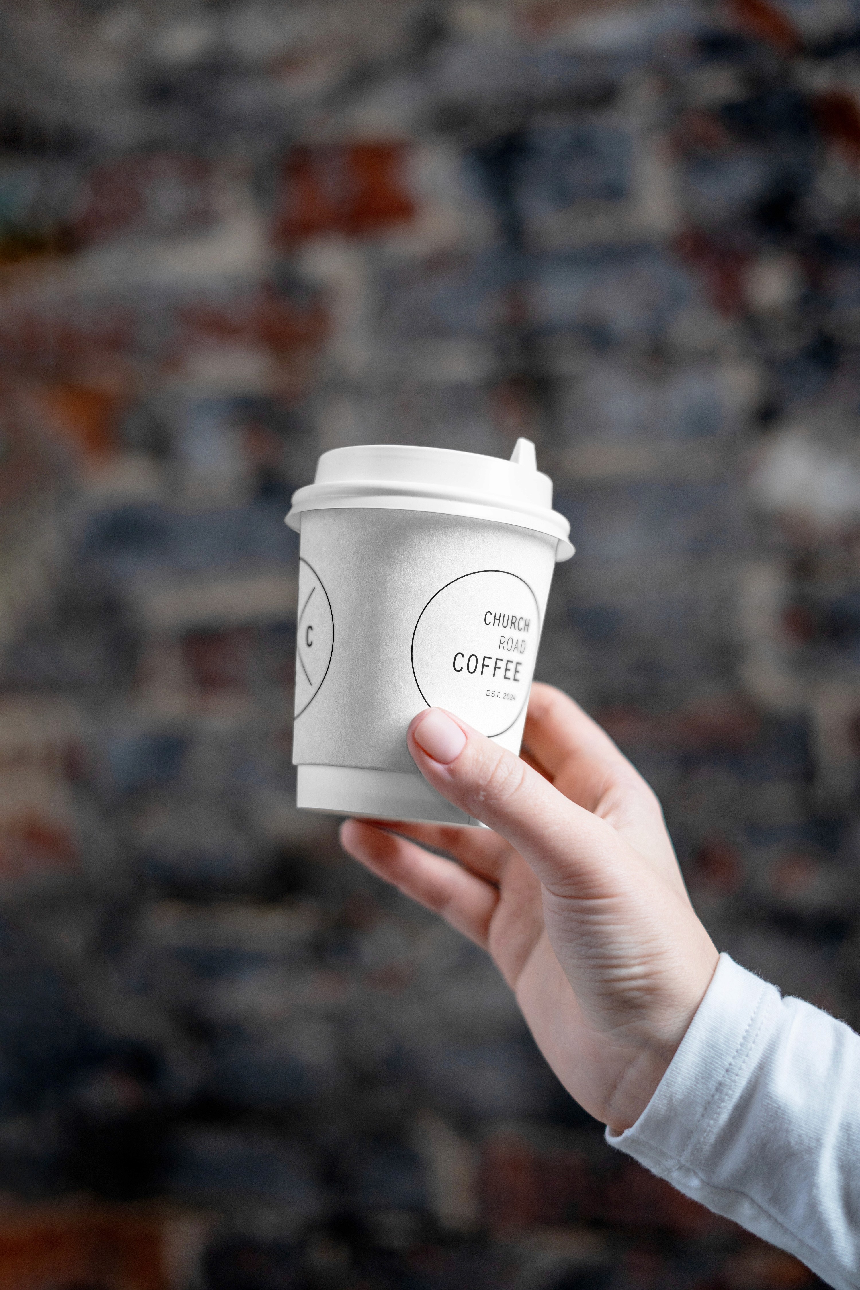 Stack of modern books and magazine with minimalist cover design on leather chair