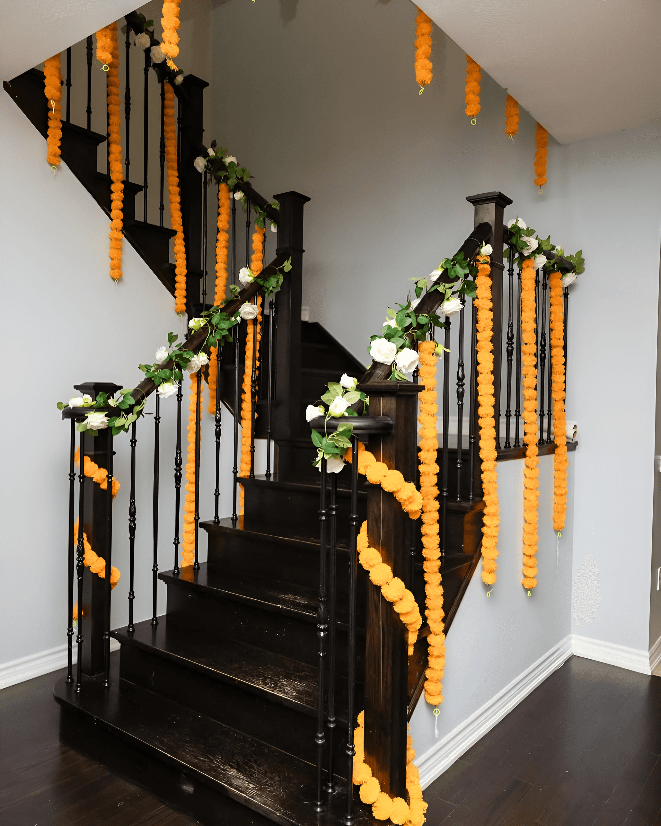 Stair decoration with real orange marigold garlands, perfect for inside home wedding decoration in Vaishali, Ghaziabad & NCR