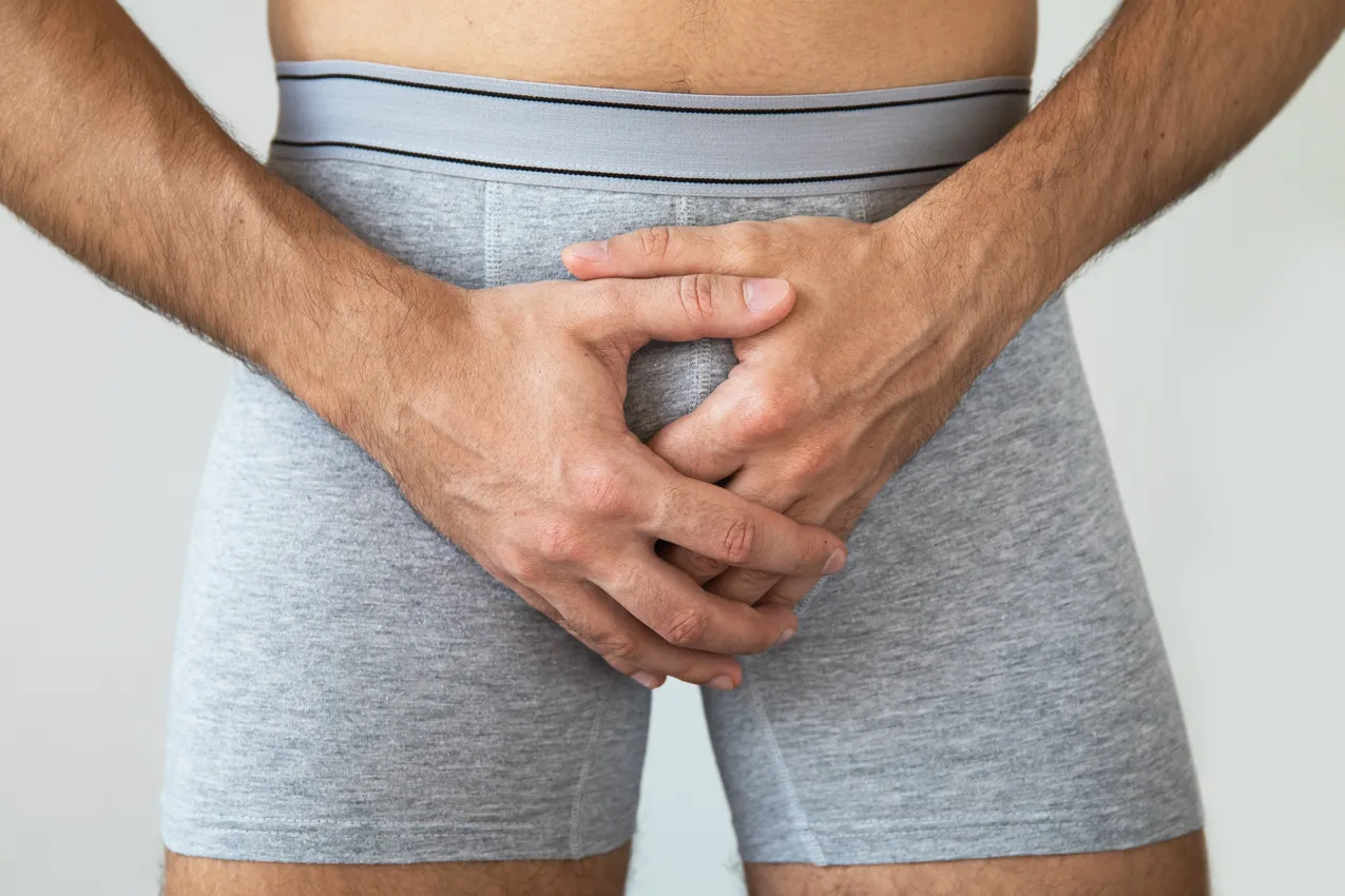 man in tight grey boxer shorts