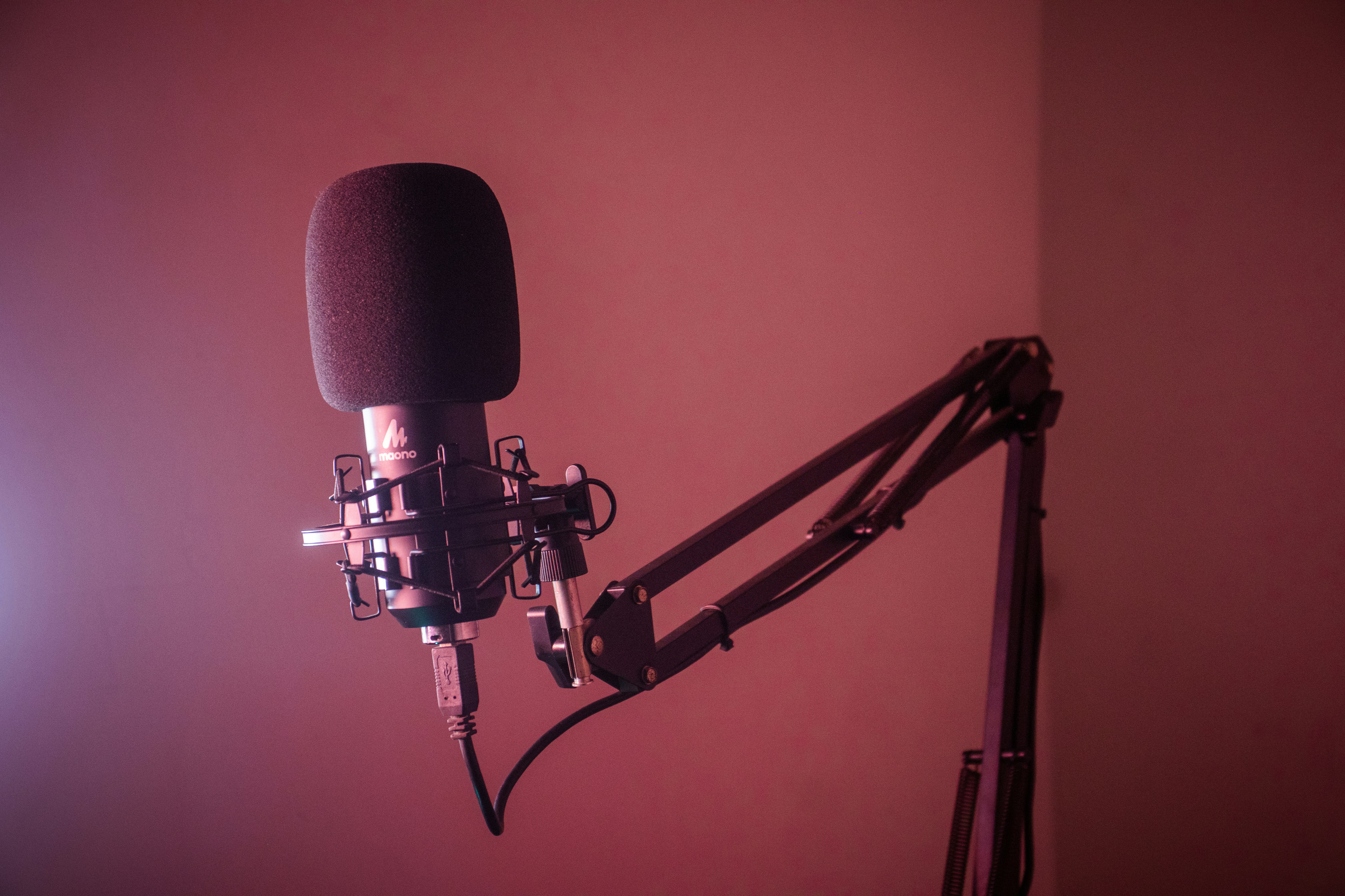 a mic with pink background - kpop ai voice generator