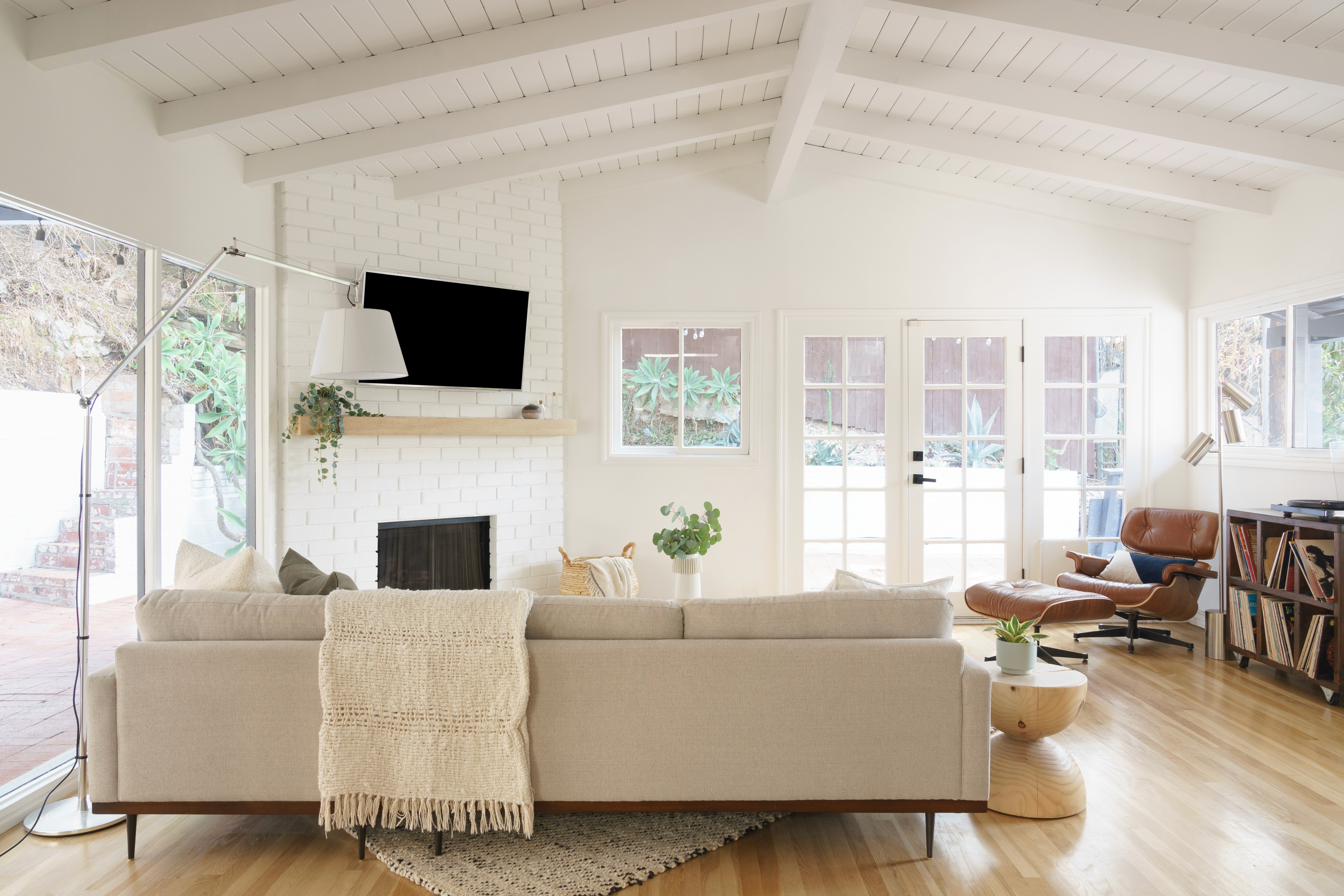 Mid-century living room refresh with a blend of classic design and contemporary comfort  by Ventura & Los Angeles interior designer Jubilee Interiors