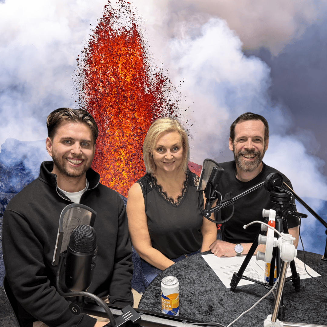 Kári Valgeirsson, geologist and science communicator at the Hellisheiði Geothermal Power Plant, with Ragnhildur Ágústsdóttir (Lady Lava, Founder of Lava Show) and Ian MacKinnon (Lava Master at Lava Show), recording an episode of the Lava Academy Podcast. The hosts interview Kári about geothermal energy, with a volcanic eruption background symbolizing Iceland’s volcanic power.
