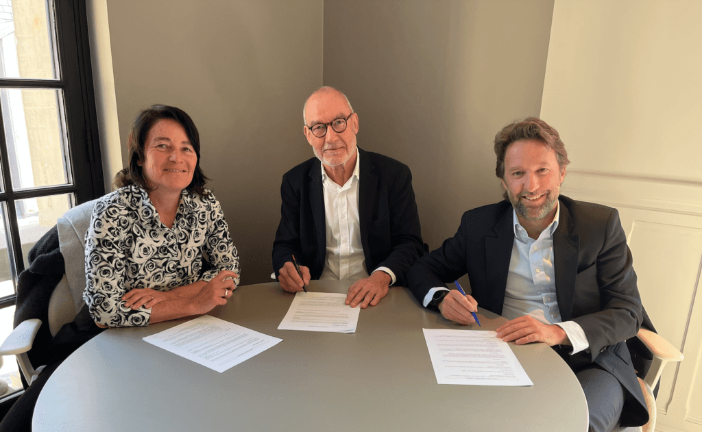 brown and white concrete house near green trees during daytime