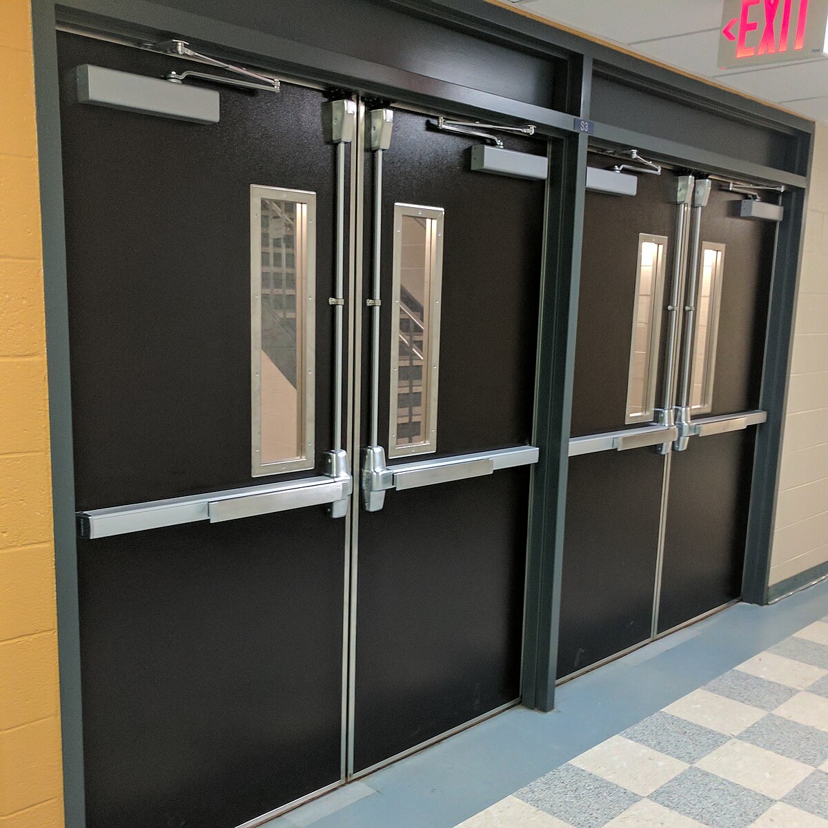 Set of double doors with crash bars