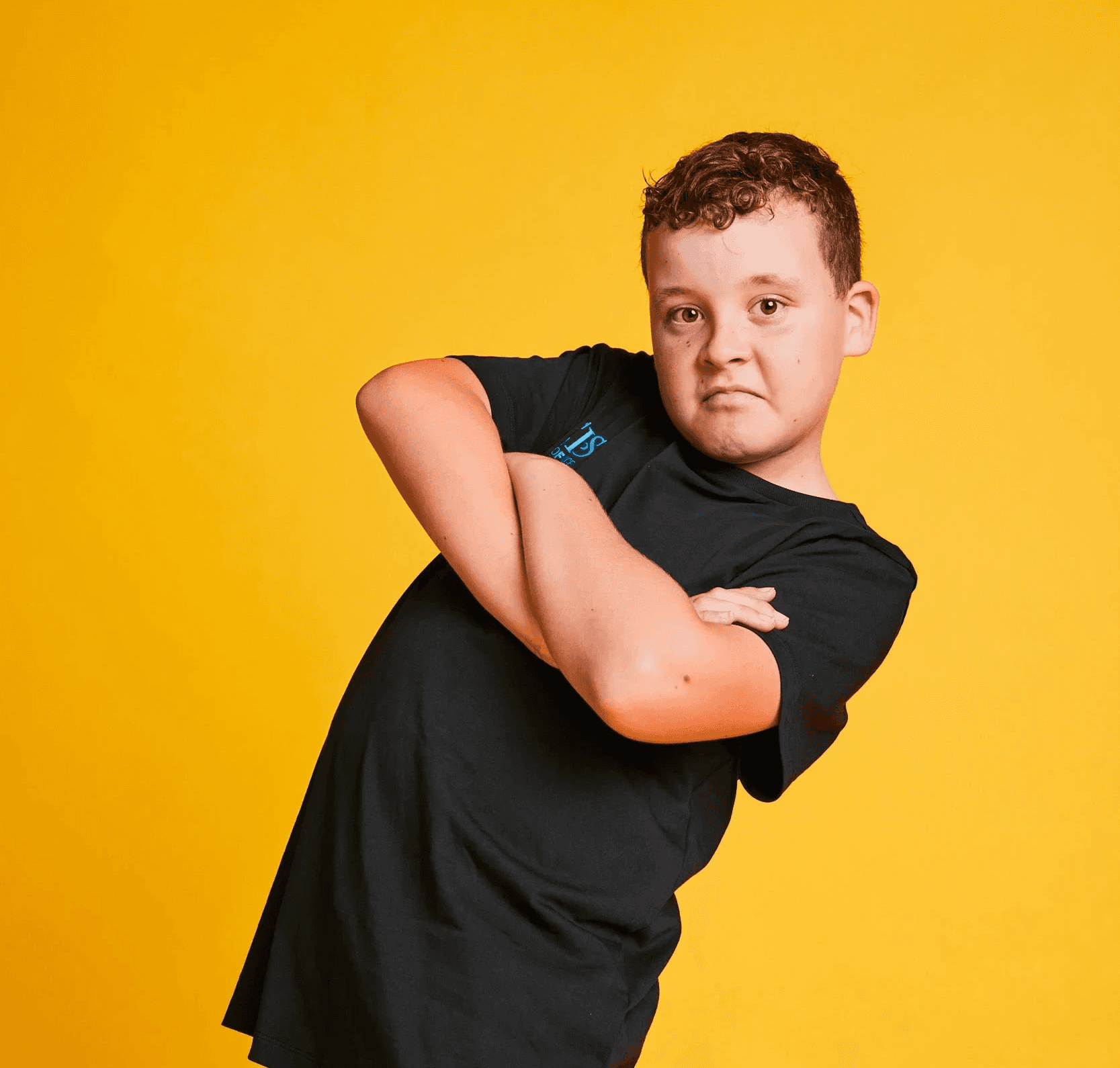 Male hip hop student with arms crosses