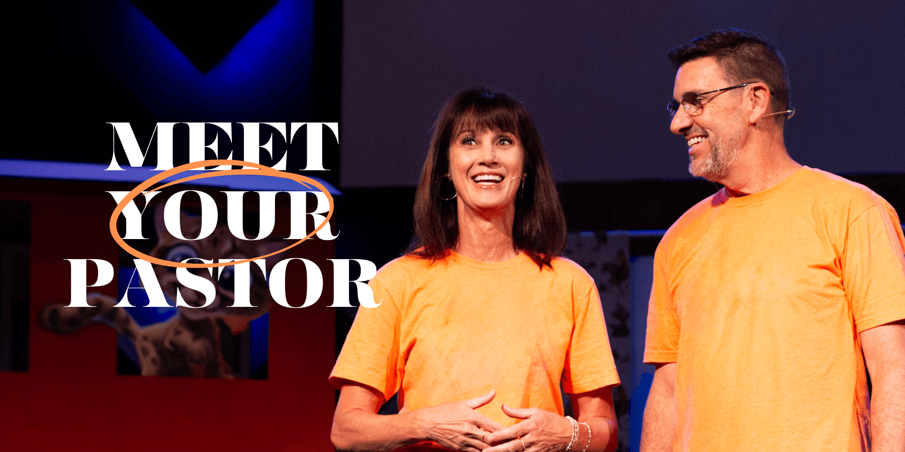 Big words "Meet your pastor" plus pastor and his wife smiling from the stage