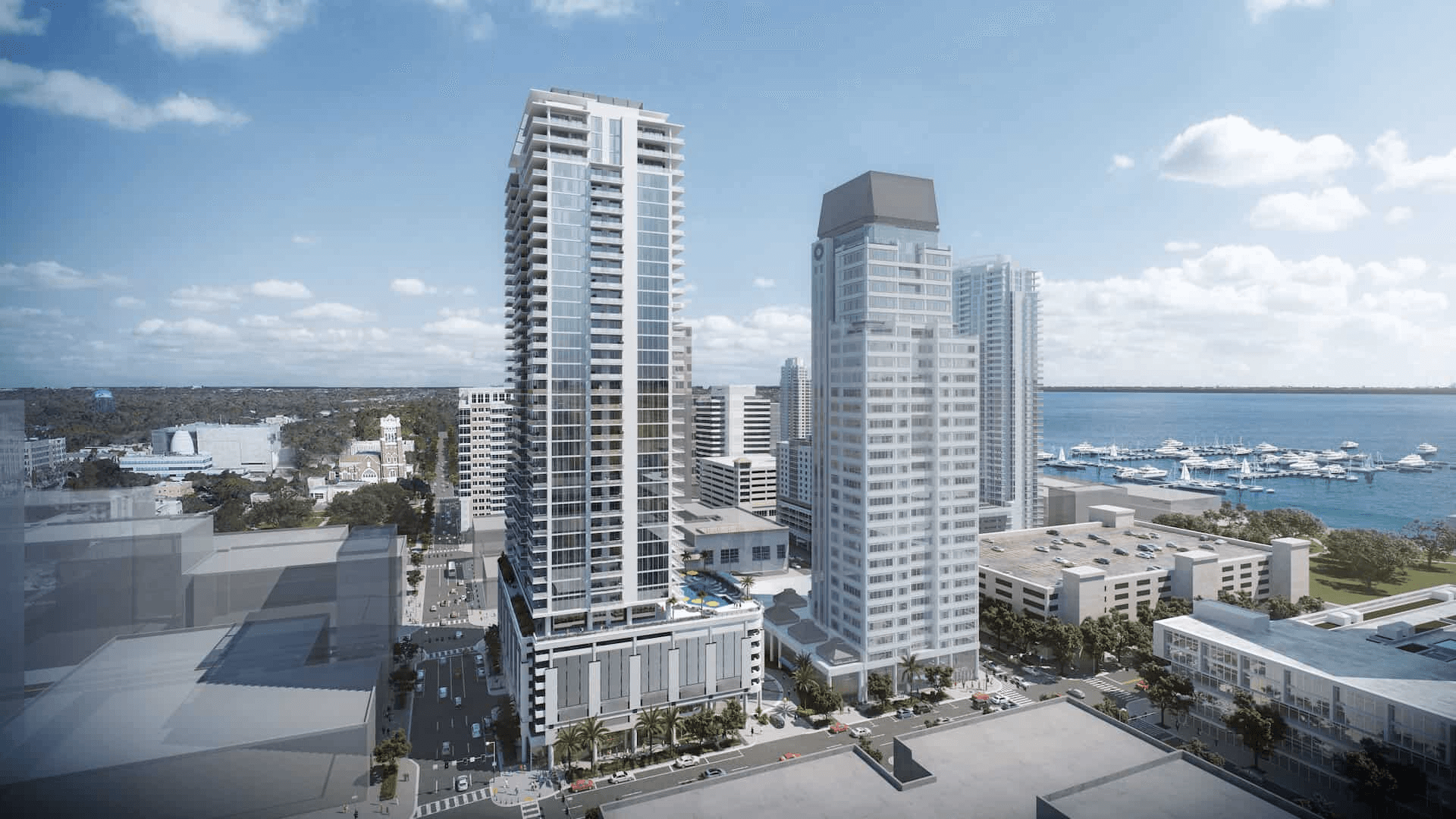 Wide view of Art House St. Petersburg building complex with waterfront and bay area in the background