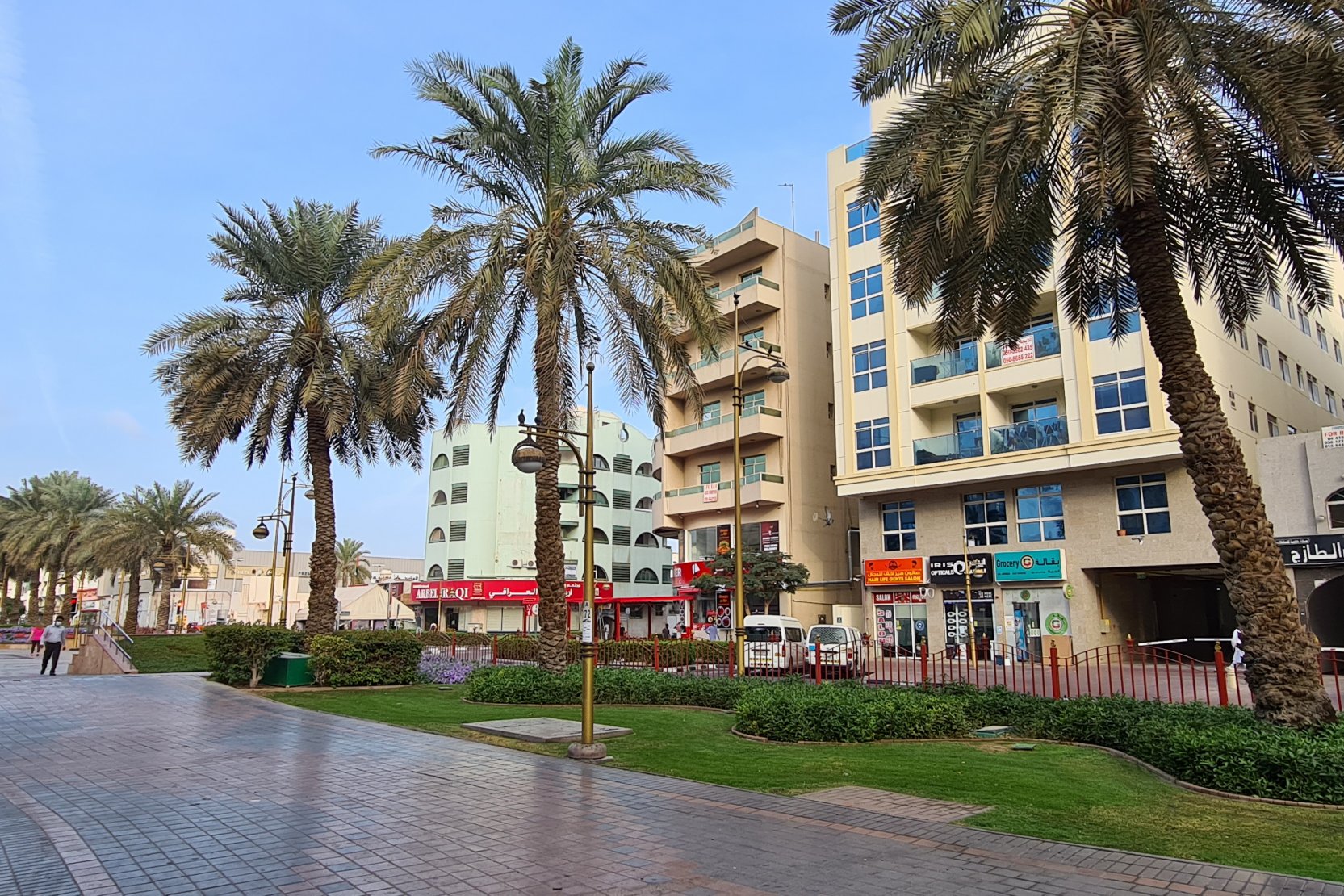 Street view of residential blocks in Muteena Dubai. Dedicated real estate agents offering local market expertise.