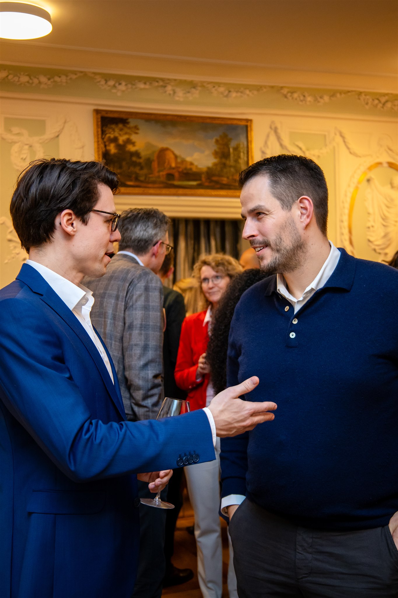 Guests shaking hands during Recht KI launch event in Zurich