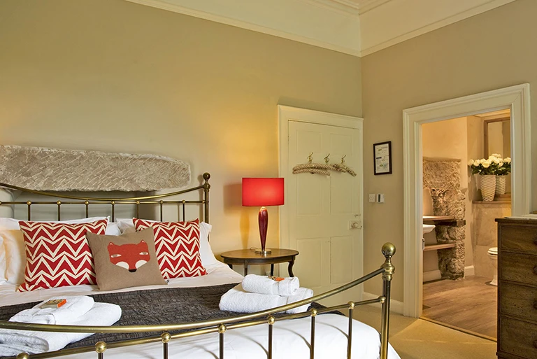 Hartingtons Heritage Tours hotel, Darley House, bedroom with metal framed bed