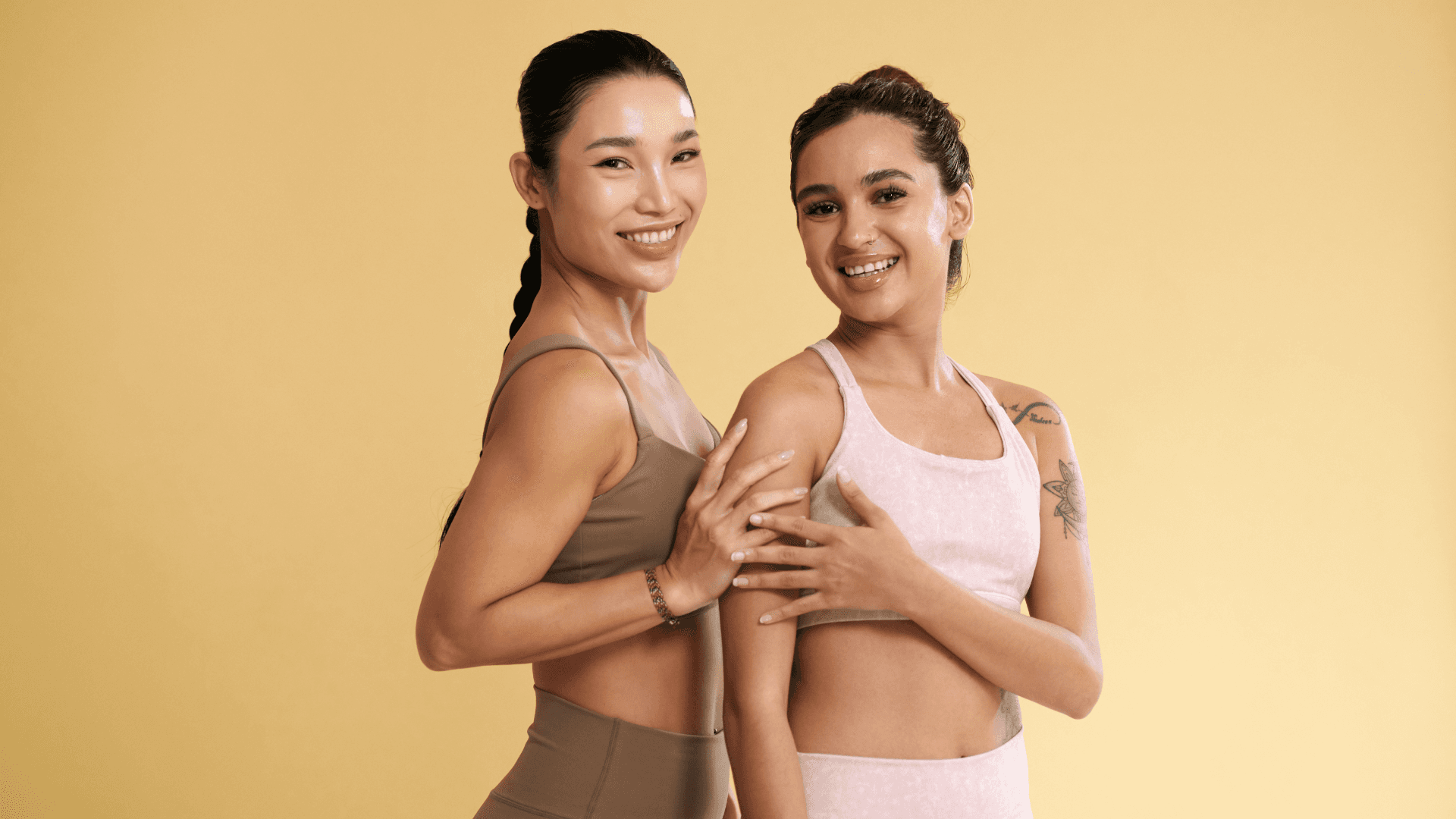Man sitting on the ground outdoors stretching his leg