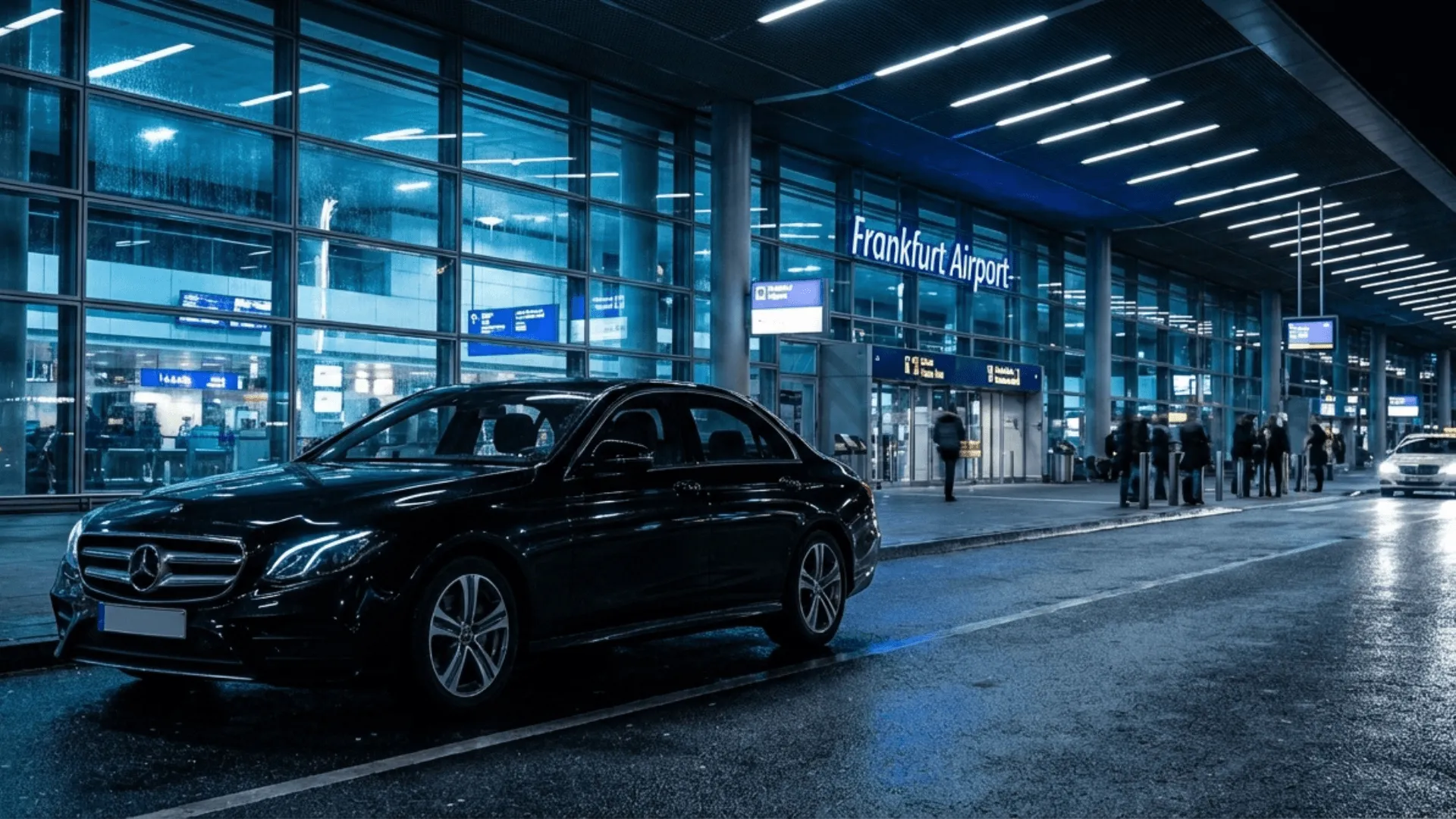 black mercedes benz in front of Frankfurt airport