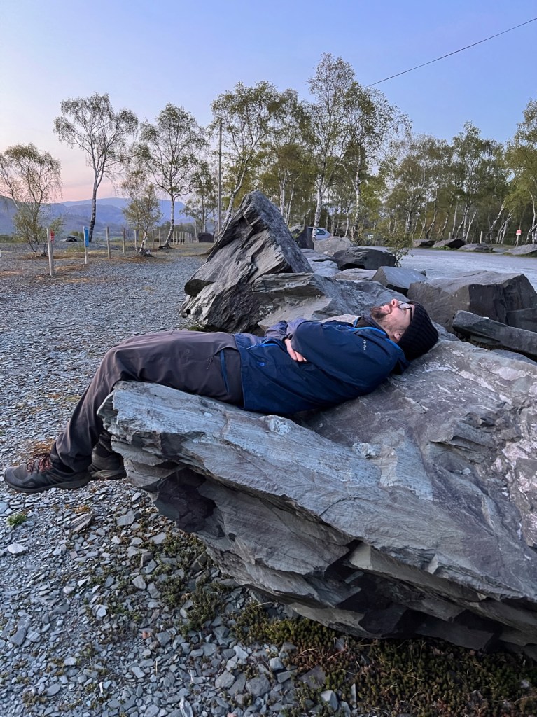 Martin sat on a large, bench-shaped stone, looking up at the sky.