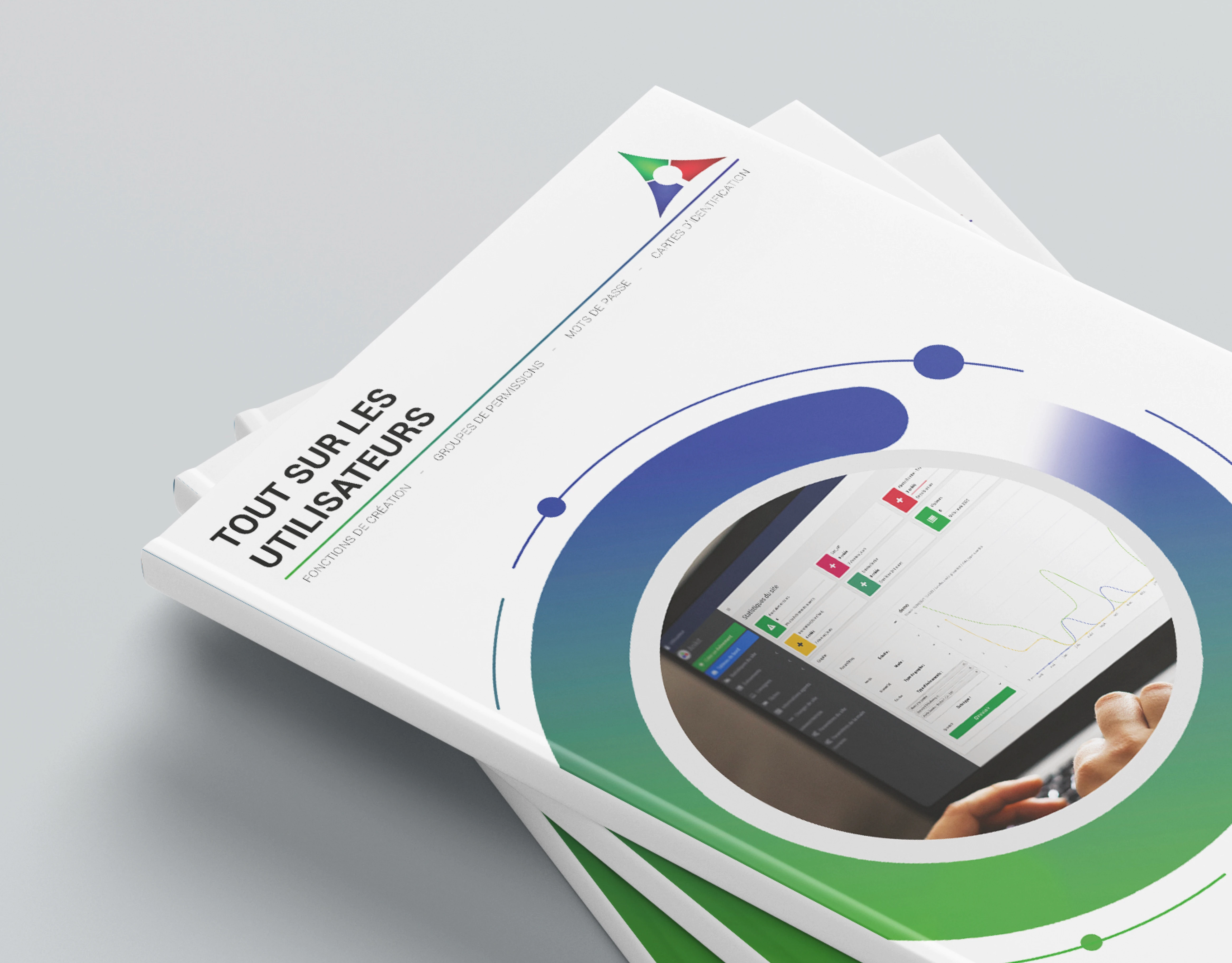 Mockup pile de guides utilisateur AniKit en format paysage — couverture et tranches bleues visibles, collection de livrets thématiques onboarding pour environnement industriel, Tartelette Concept