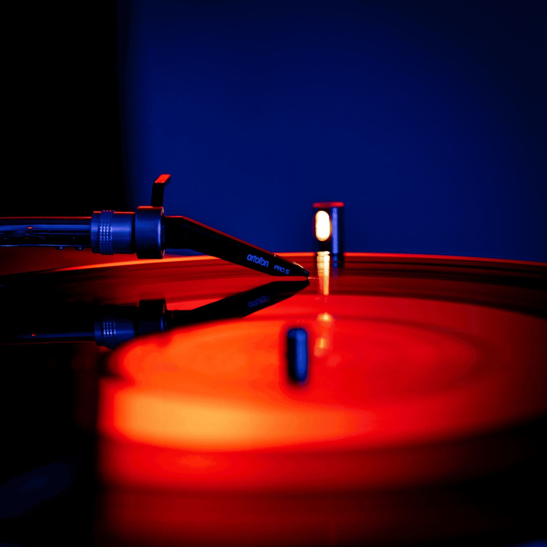 Close up shot of a needle on a vinyl record