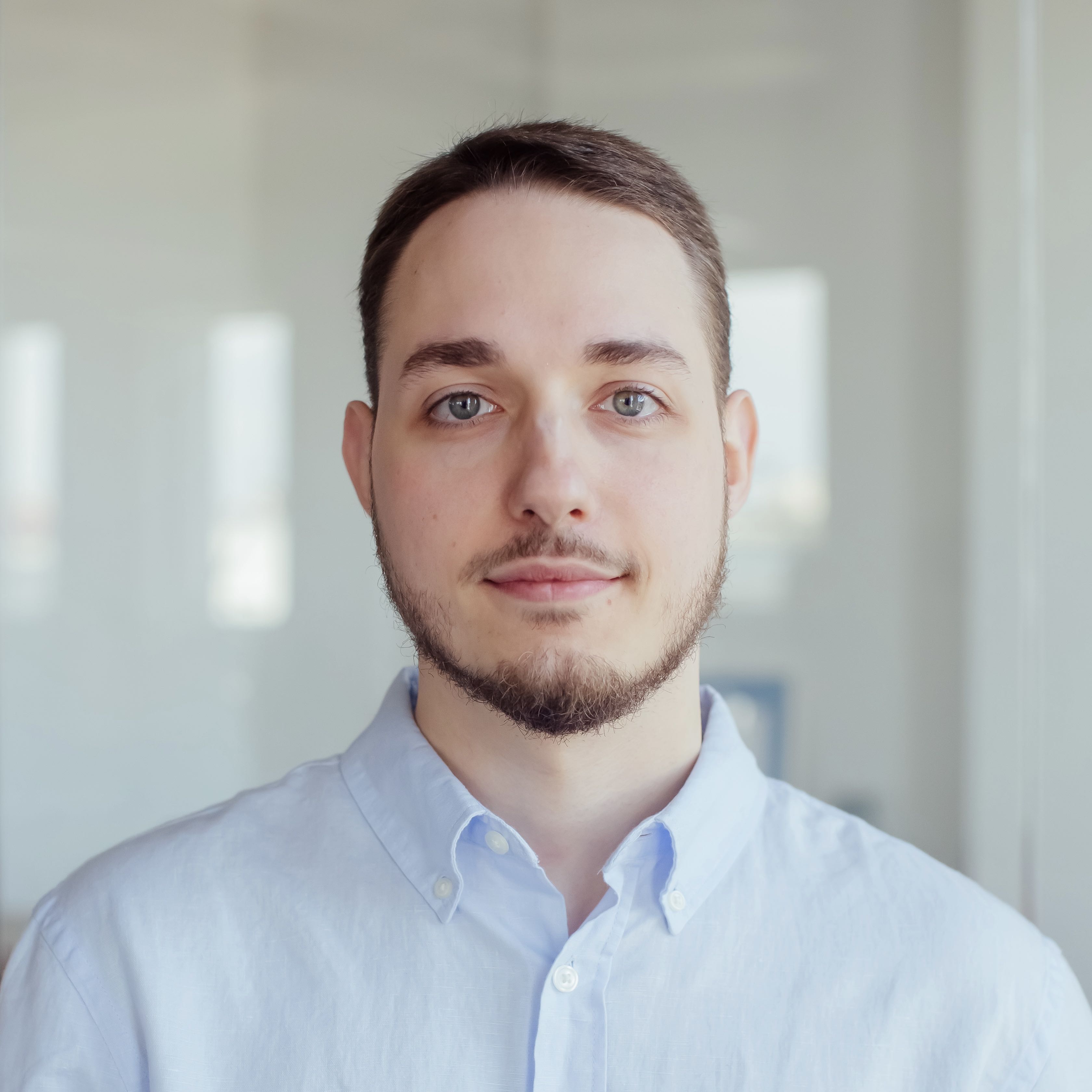 Portrait of a young guy on a blue background