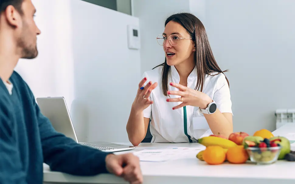 Wellness specialist talking to patient about treatment options. 