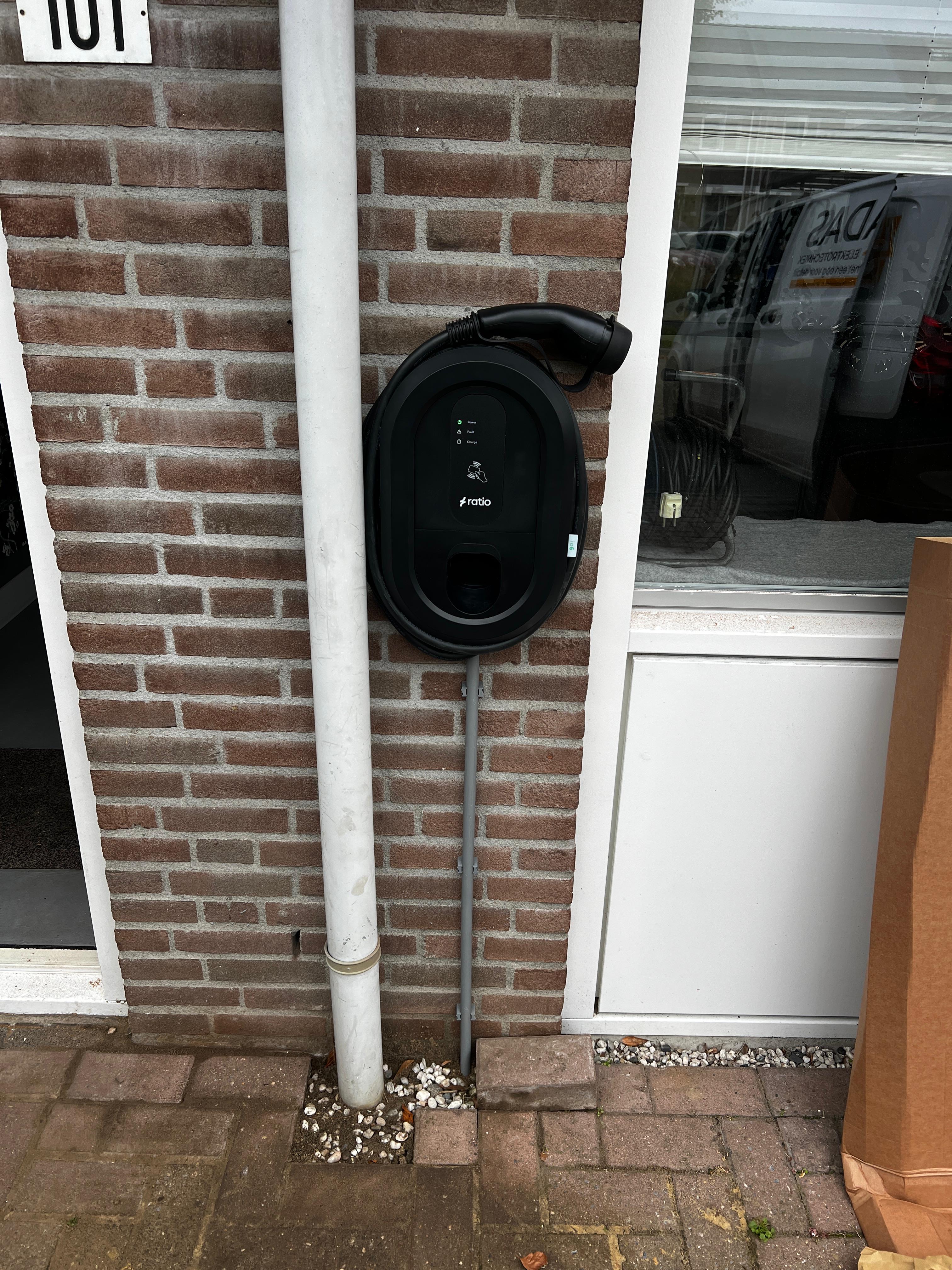 Modern glass building with illuminated trees and a view of city skyscrapers