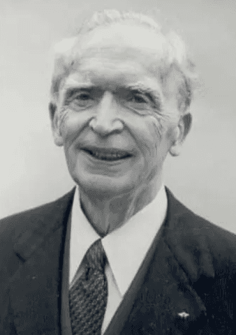 Person wearing white full-face hood with only eyes visible.