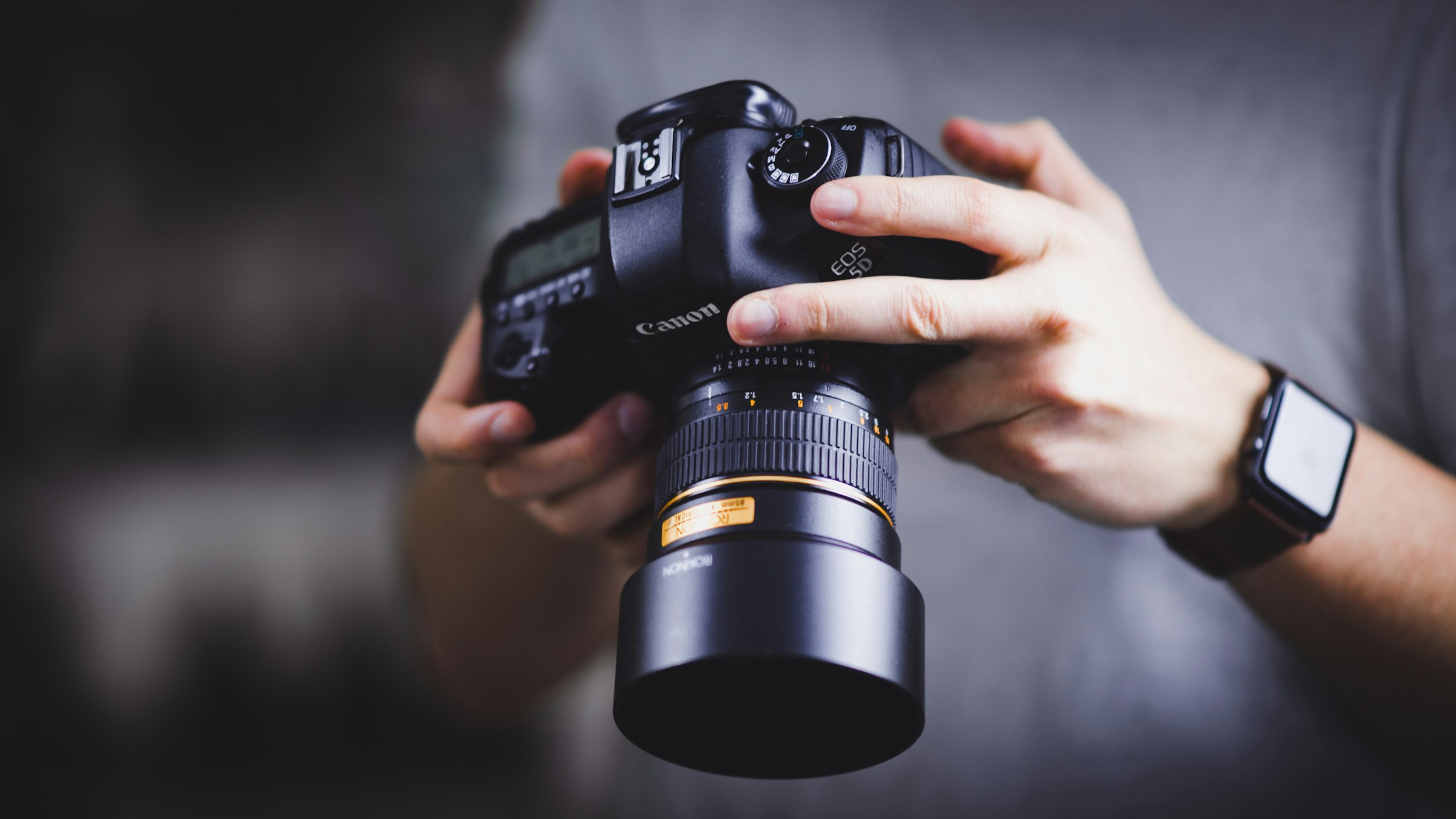 man holding camera - eCommerce Photography