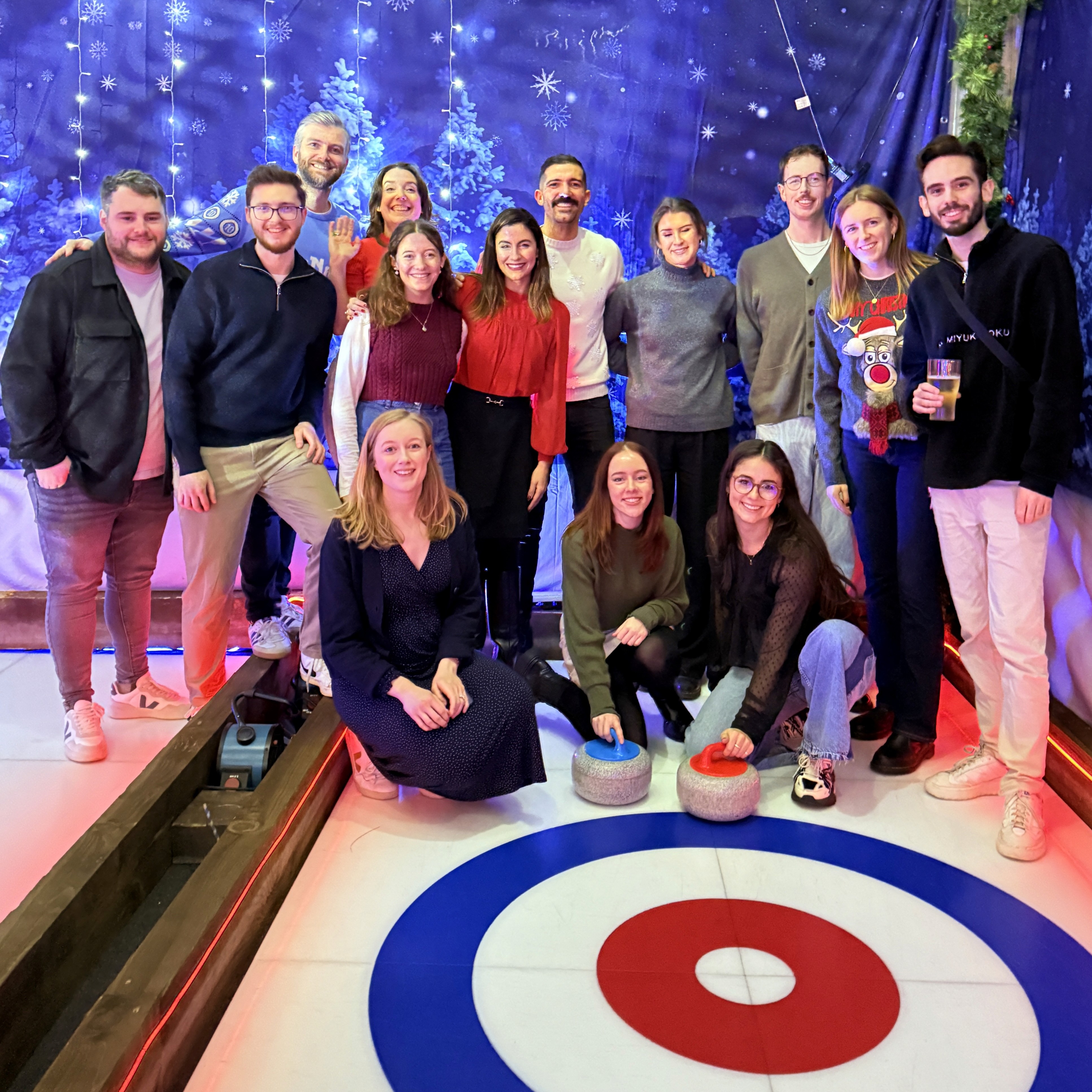a group of people walking on a sidewalk