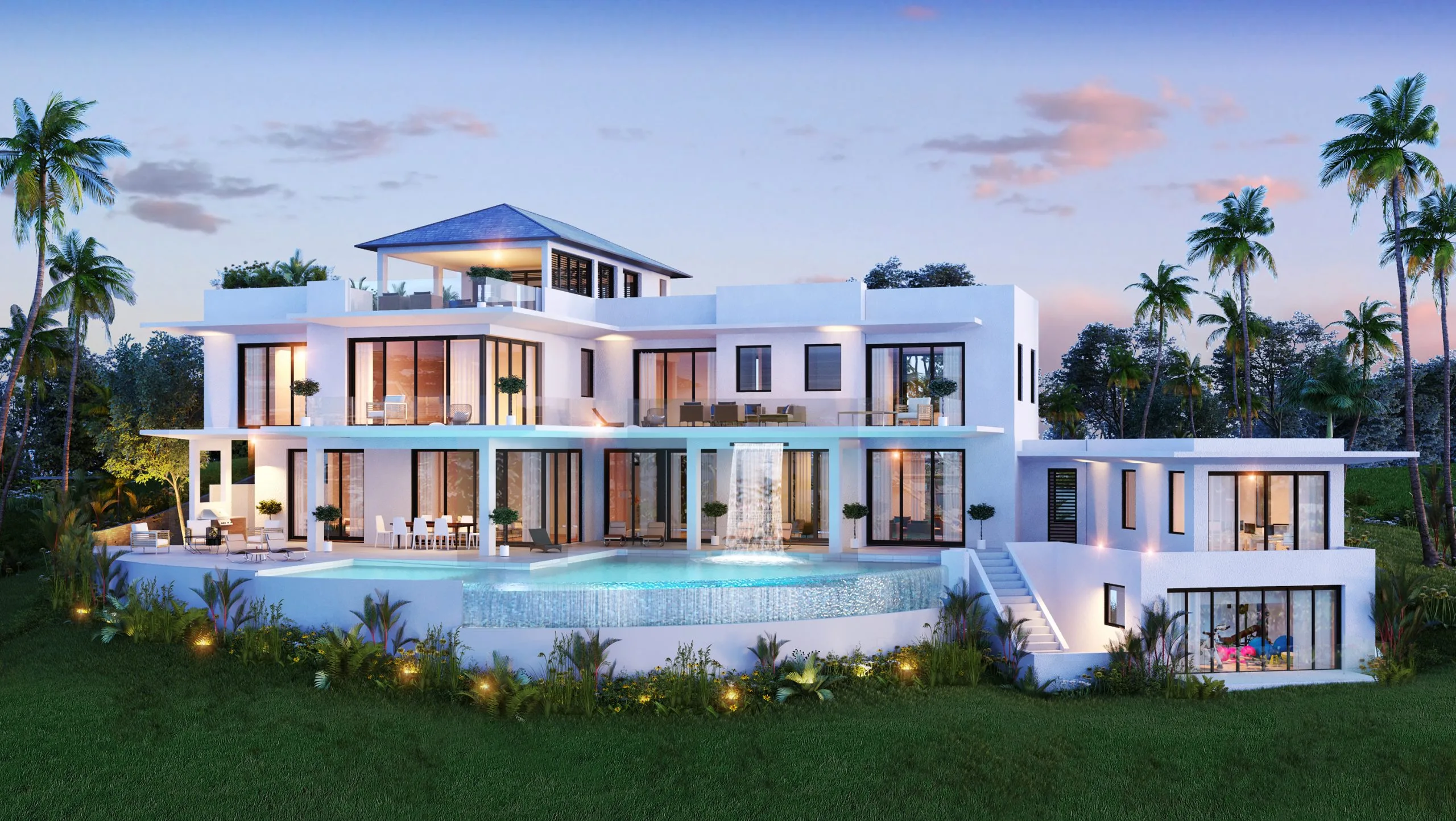 Rear exterior of luxury villa with waterfall pool and wrap-around balconies at night, St. Lucia