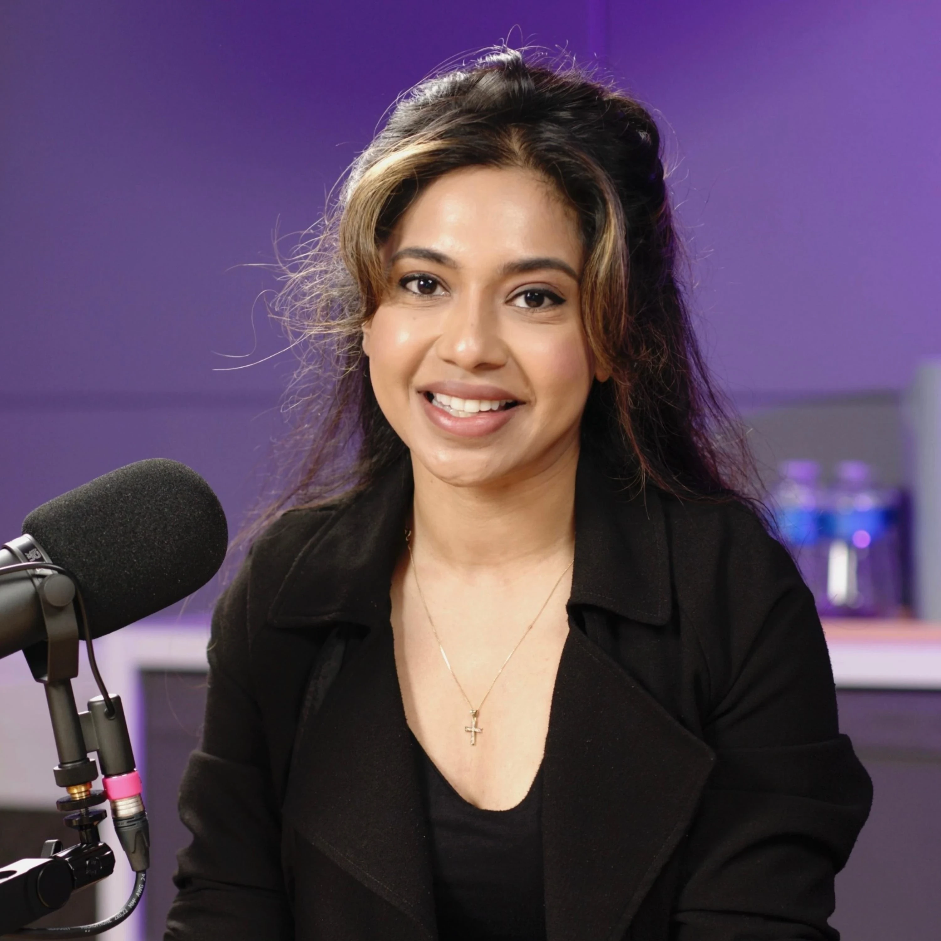 Dr Veena Babu, GP, broadcaster and Health Influencer, recording at the Creative Kin London podcasting studio at Royal Arsenal