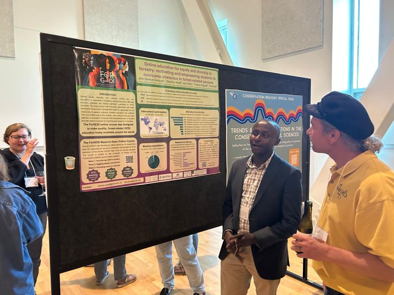 low angle photography of black transmission tower