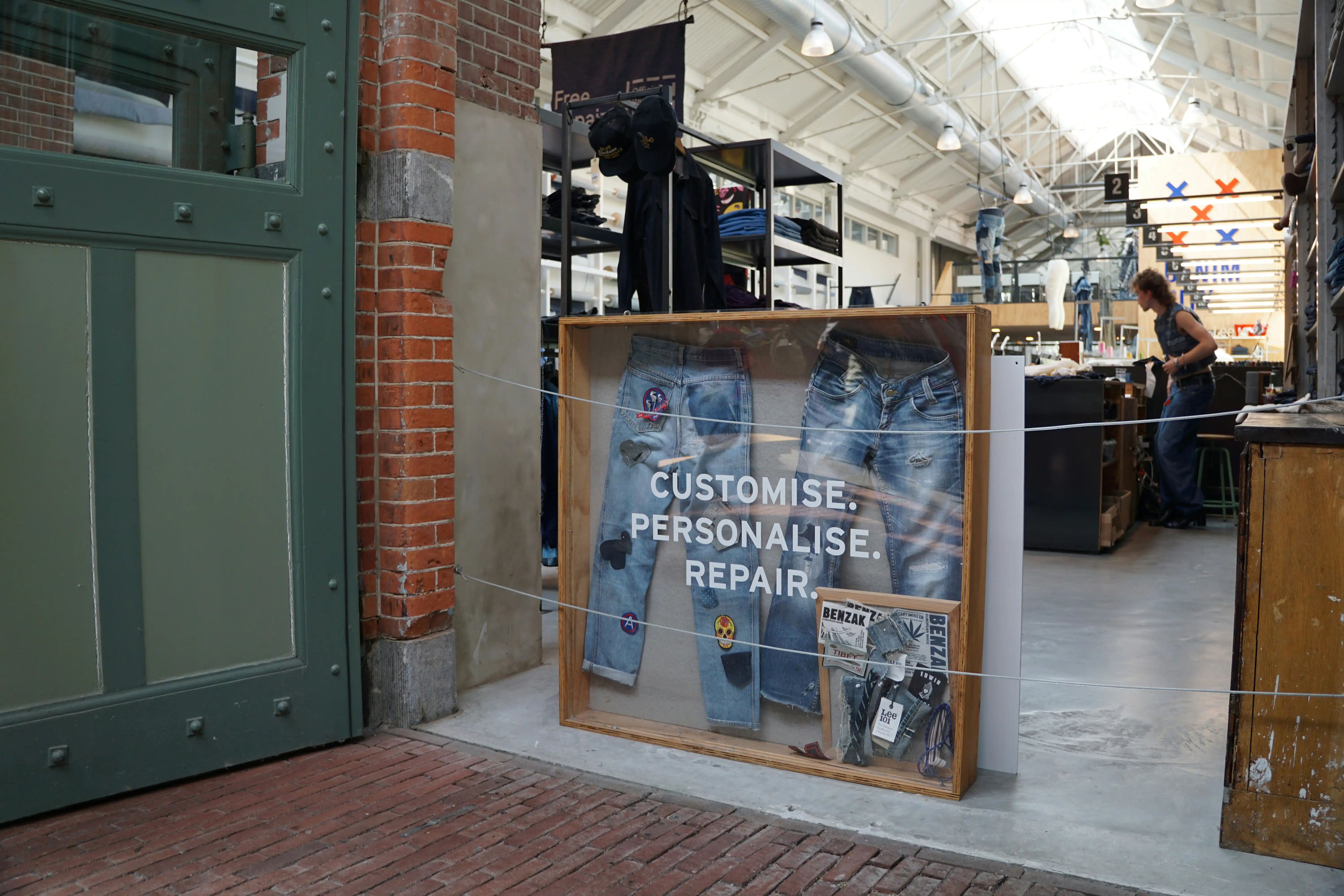 Atellier entrance with written motto: "Customise. Personalise. Repair."