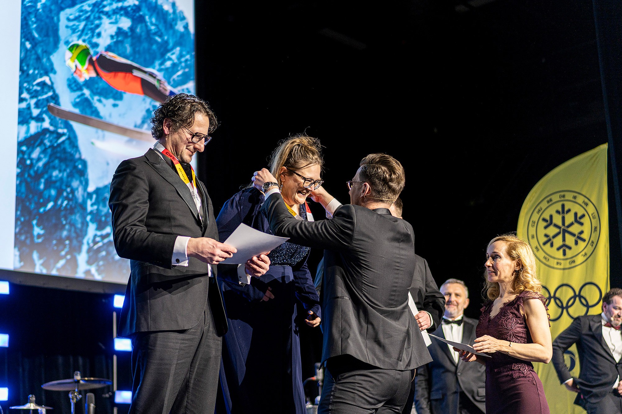 Speaker taking part in a panel discussion during a professional conference session.