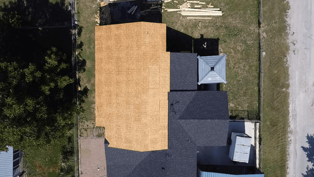 residential roofing services in Arlington performing a full roof replacement with new plywood roof decking installation.
