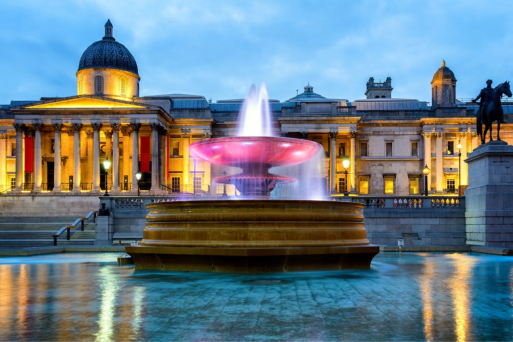 The National Gallery and Trafalgar Square in London at dusk, reflecting a calm winter atmosphere and civic continuity.