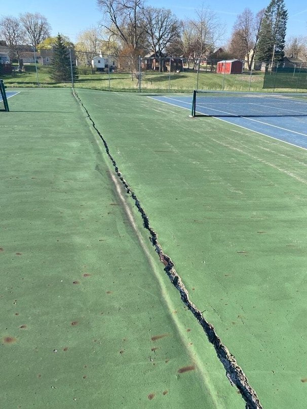 Cracked Tennis Court in need of repair