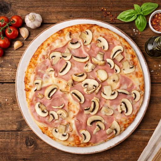 pizza with green leaf vegetable