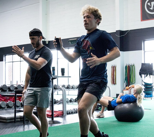 a group of people playing a game of ice hockey