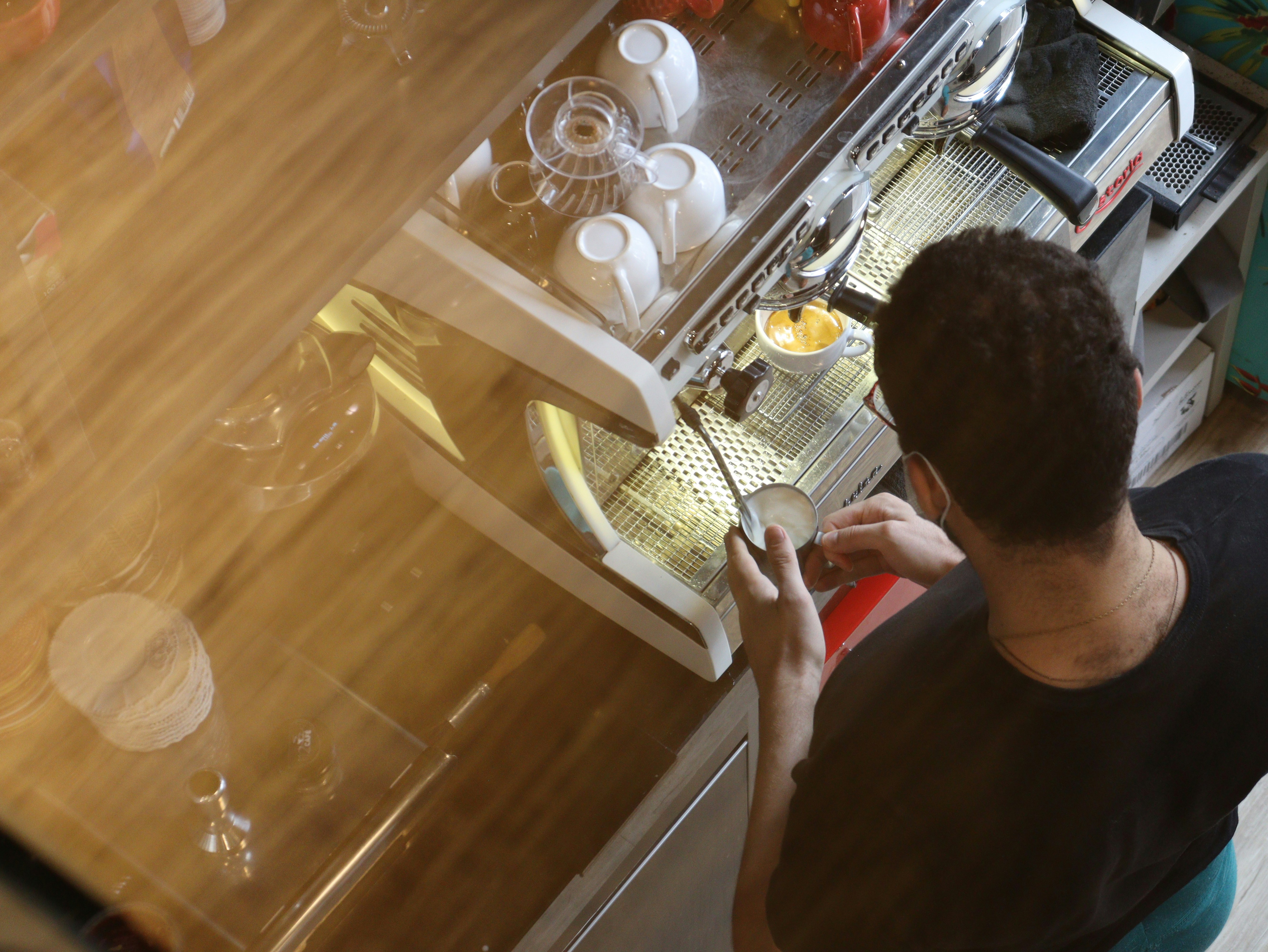 A barista making coffee 