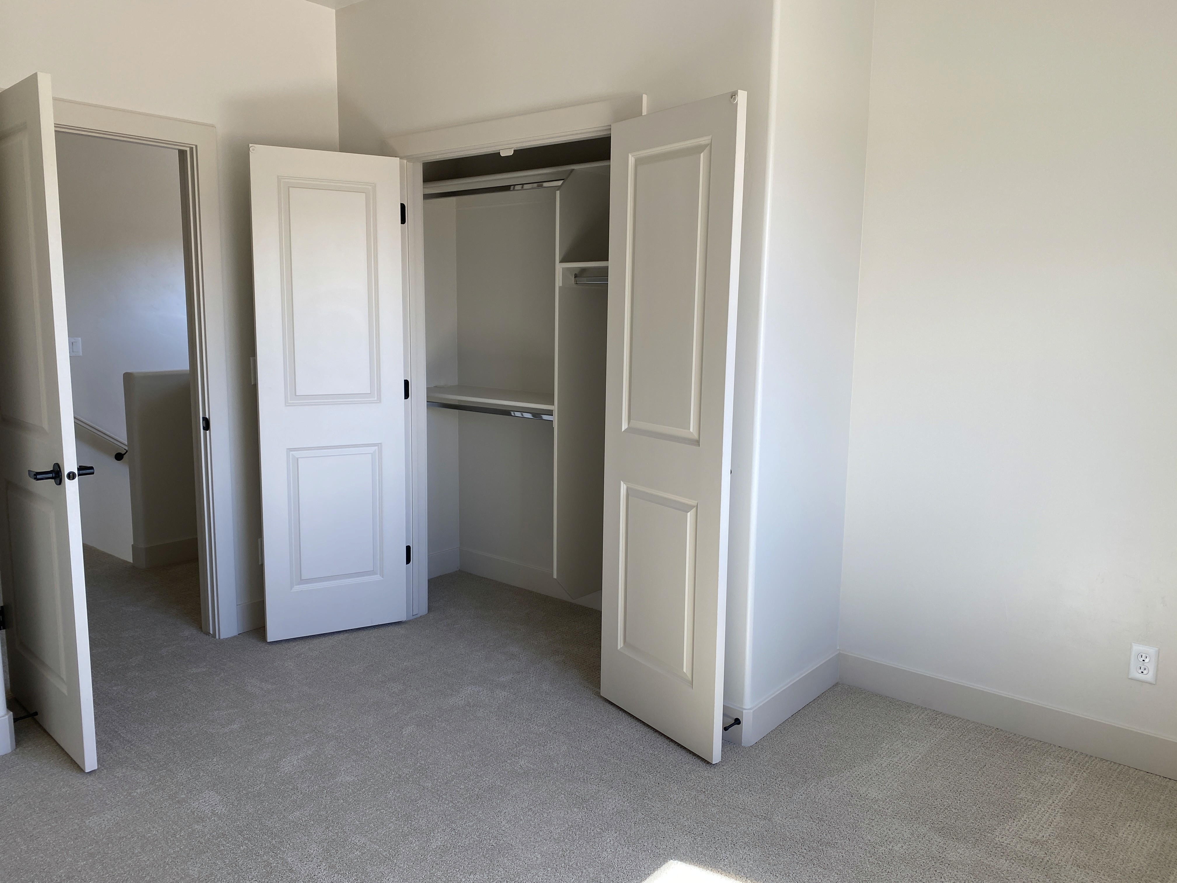 Guest bedroom closet in a Southern Utah duplex designed for everyday living