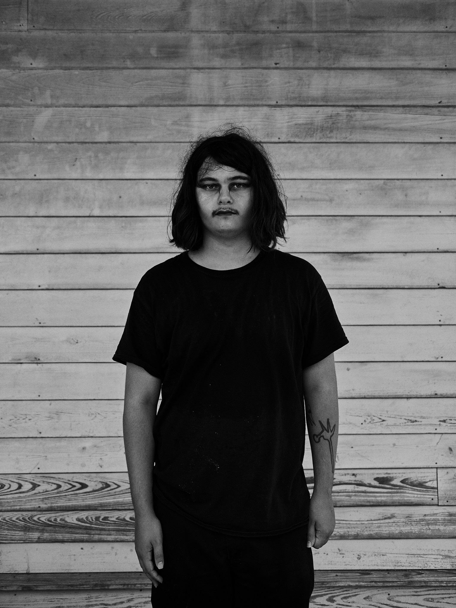 Black and white portraits of young alternative, romantic, goth, freak, punk and metal character against a textured New Orleans backdrop. 