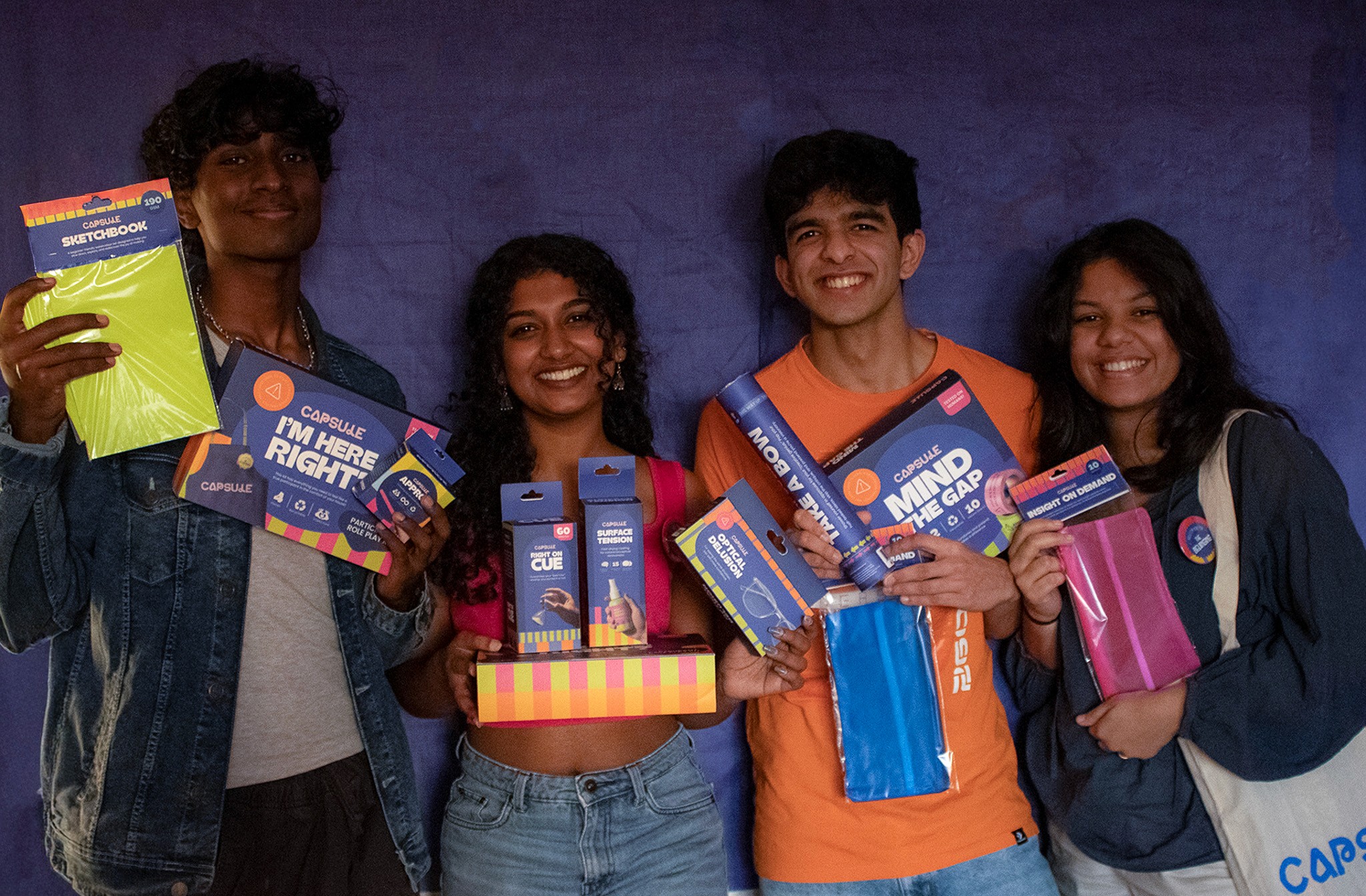 A fast black sports car races down the highway.