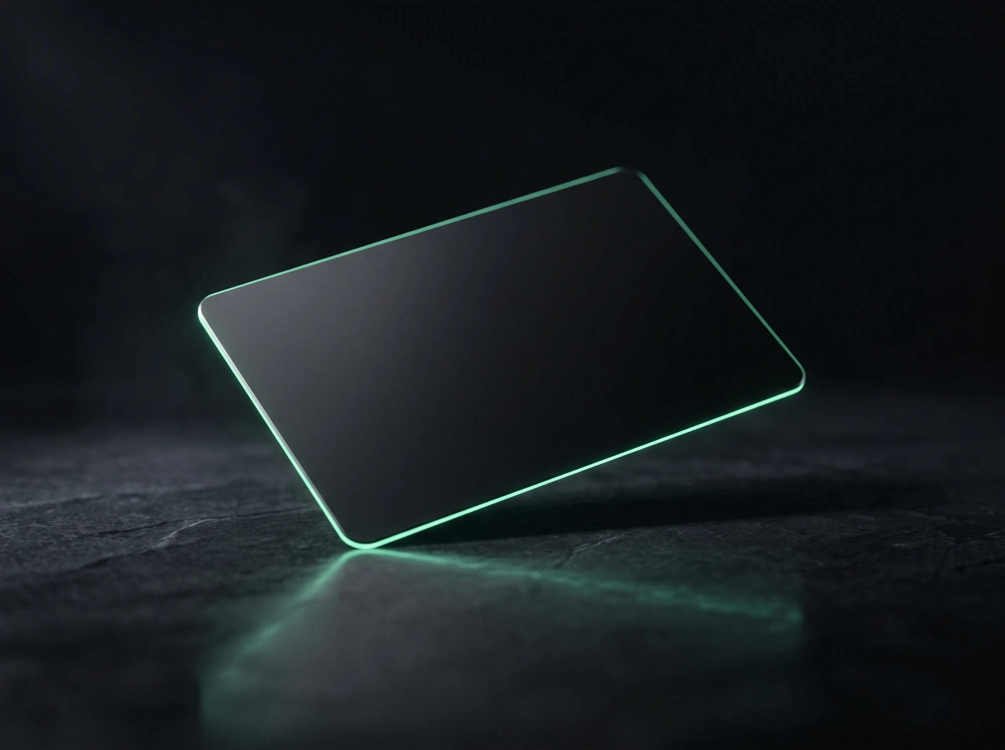 Dewpoint debit card resting on a dark surface with a soft mint edge glow