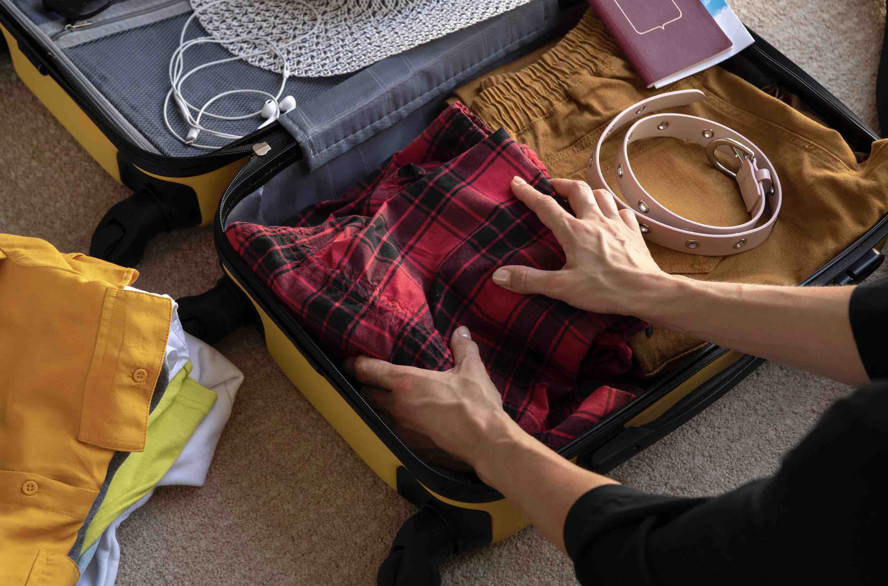 Traveler packing for Japan, gather all the essentials they will need for their trip.